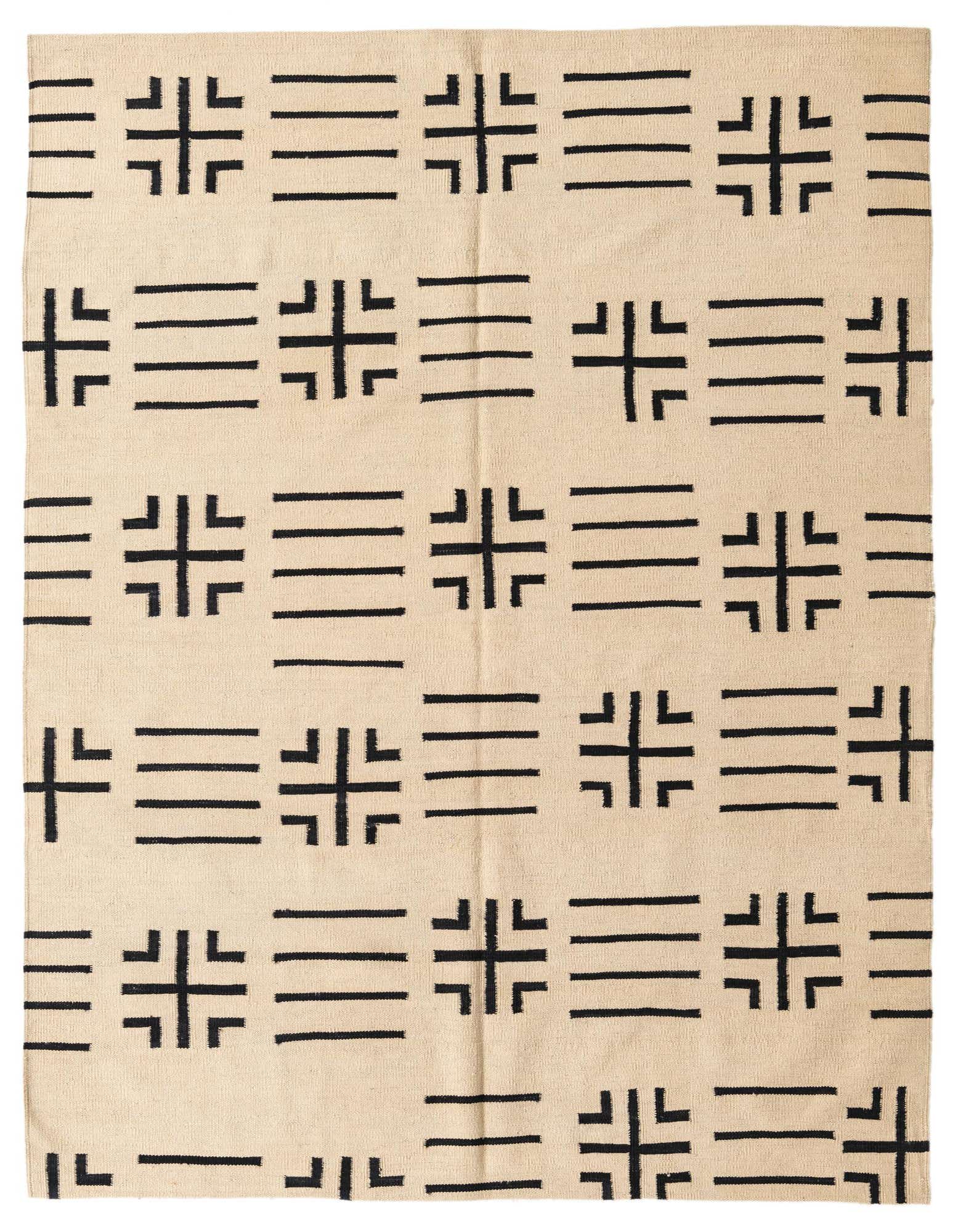 A 5x8 rectangular ivory wool rug with a black tribal geometric pattern, suitable for a modern living room.