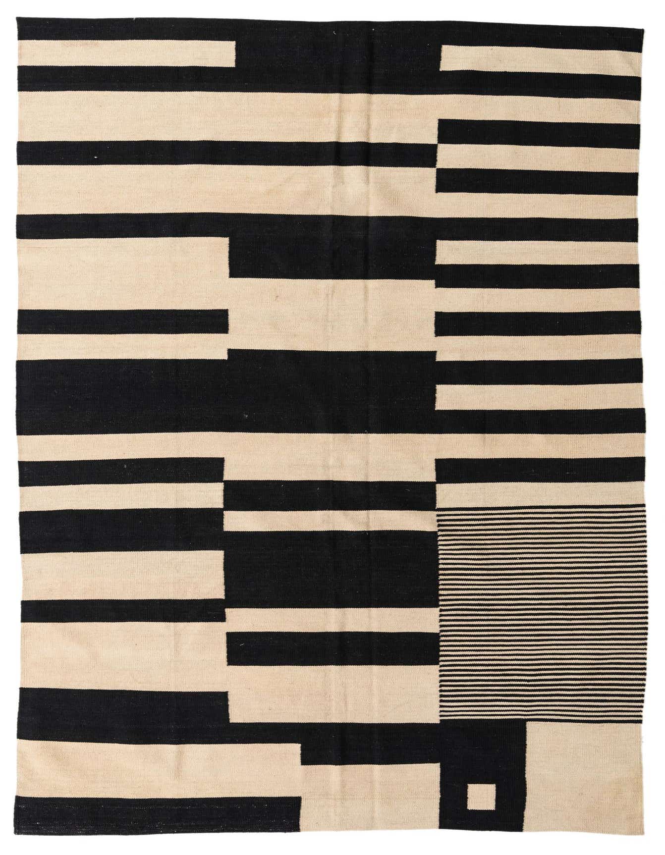 A 6x9 rectangular Kilim Modern rug with a flatweave, featuring bold black and ivory abstract tribal patterns.