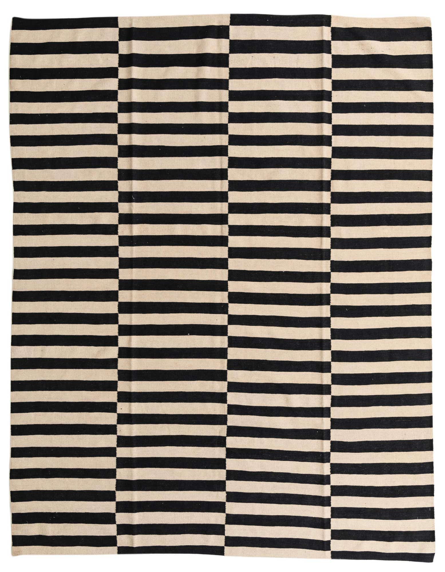 An 8x10 rectangular flatweave rug featuring a bold black and ivory striped pattern with alternating horizontal and vertical sections.