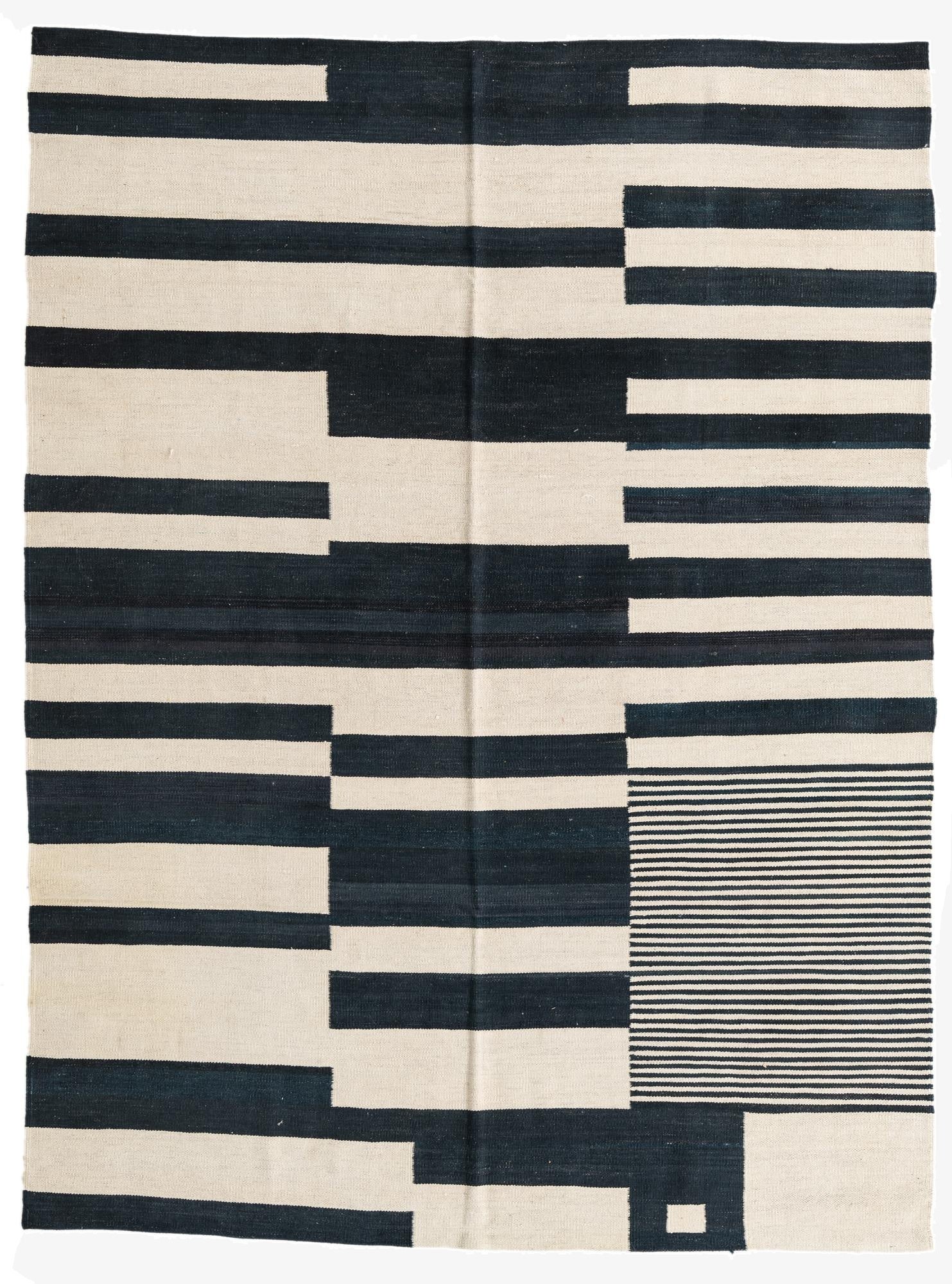 A 5x8 rectangular Kilim Modern wool rug with an abstract tribal pattern in ivory and dark blue, featuring varying stripe widths and a section of thin horizontal lines.