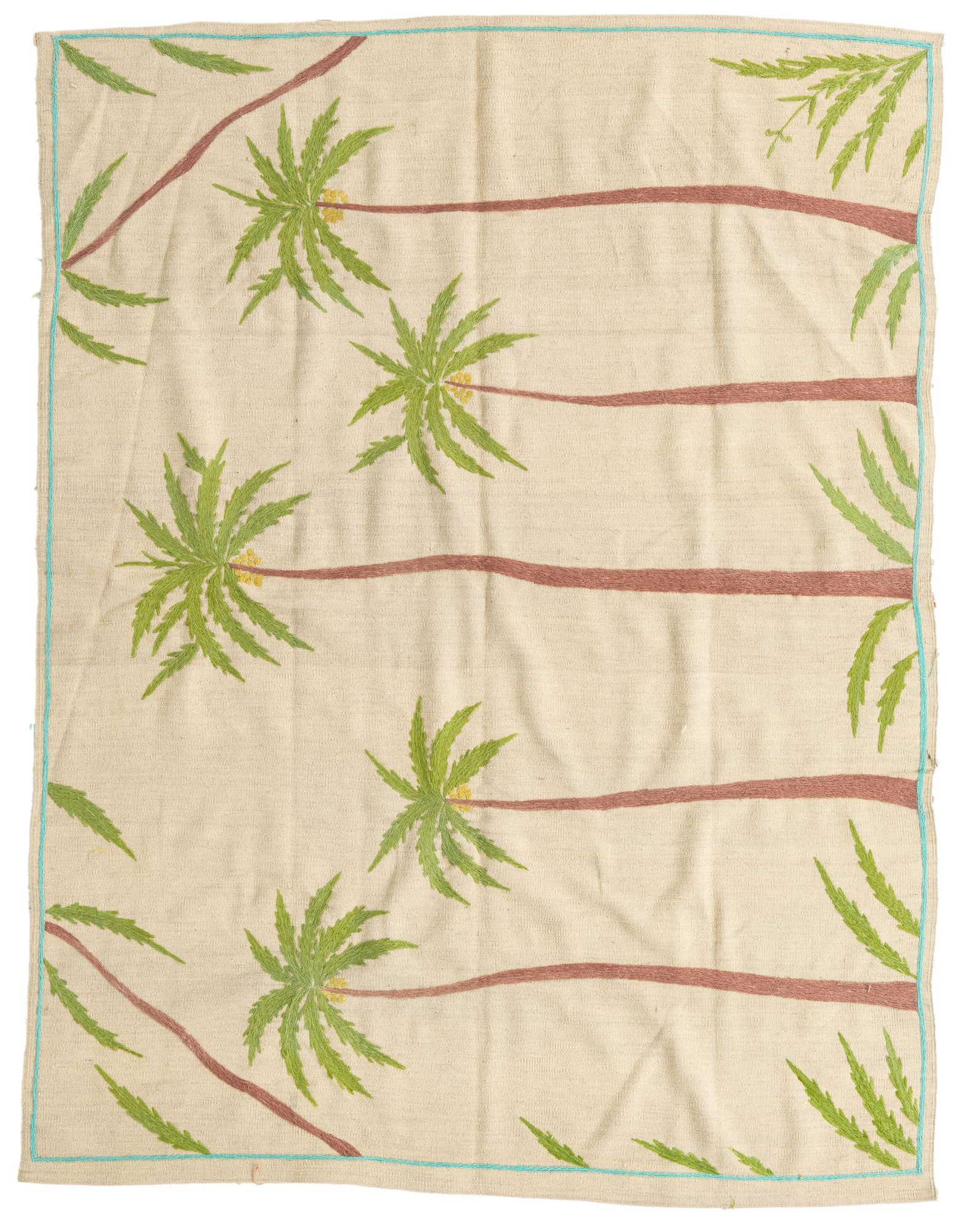 A 5x8 rectangular ivory flatweave rug with a modern tribal pattern of green palm trees and brown trunks, bordered by a thin teal line.