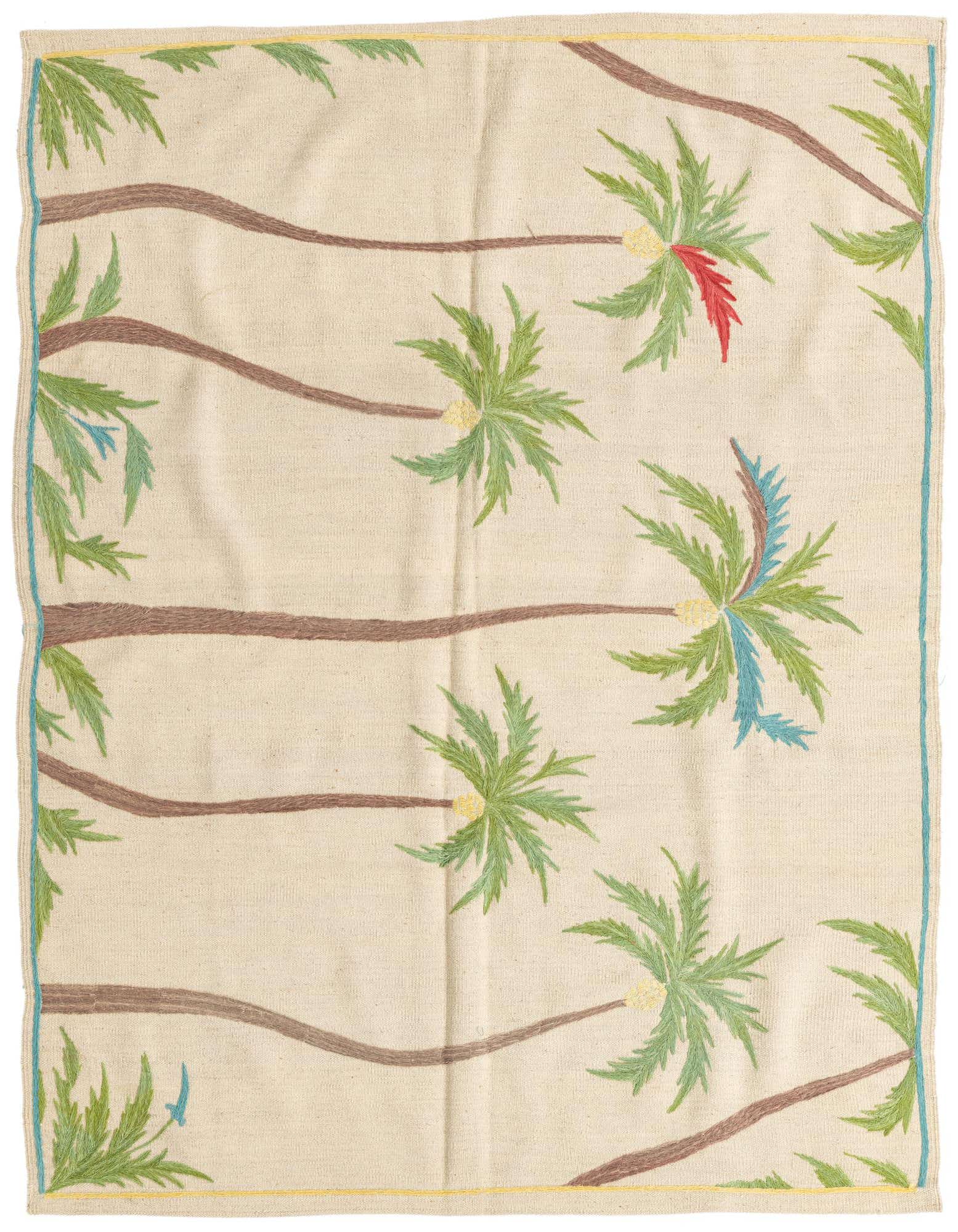 A 5x8 rectangular ivory flatweave rug with a modern tribal pattern of brown palm trees and green fronds, some with red or blue accents.