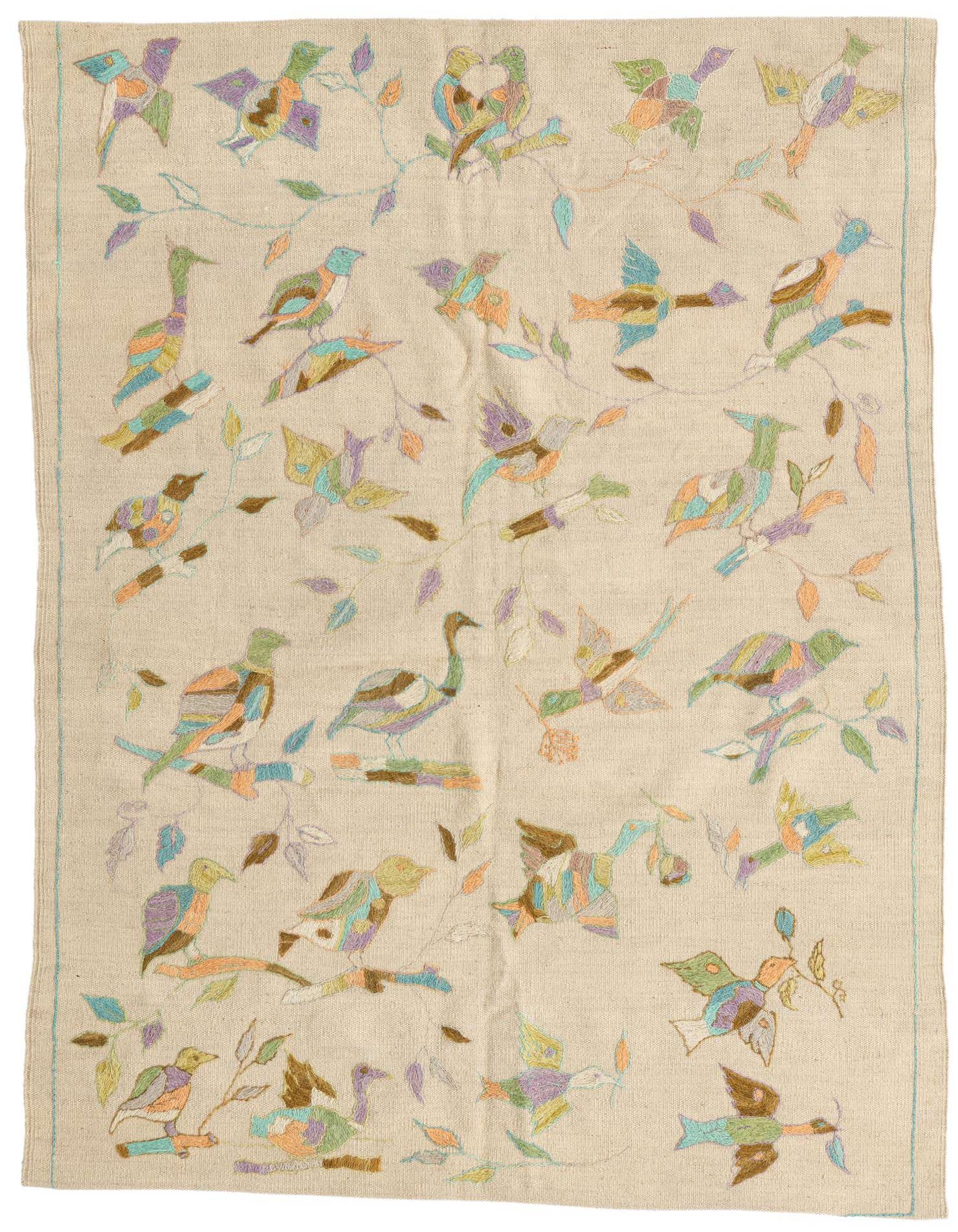 A 4x6 rectangular ivory wool flatweave rug with a colorful tribal bird and branch pattern, suitable for a living room.