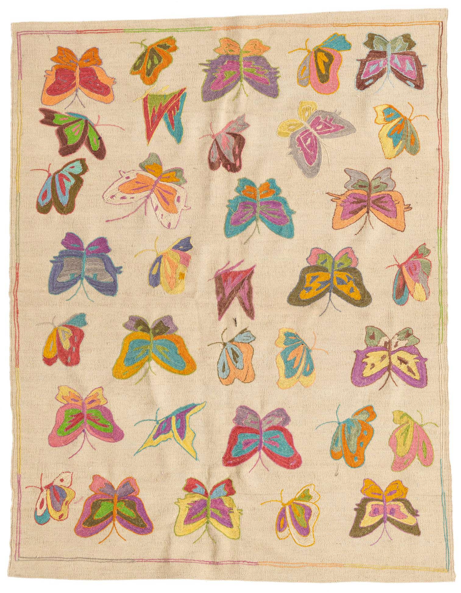 A rectangular 4x6 Kilim Suzani rug with a cream background and colorful embroidered butterflies in various sizes and hues, perfect for a living room.