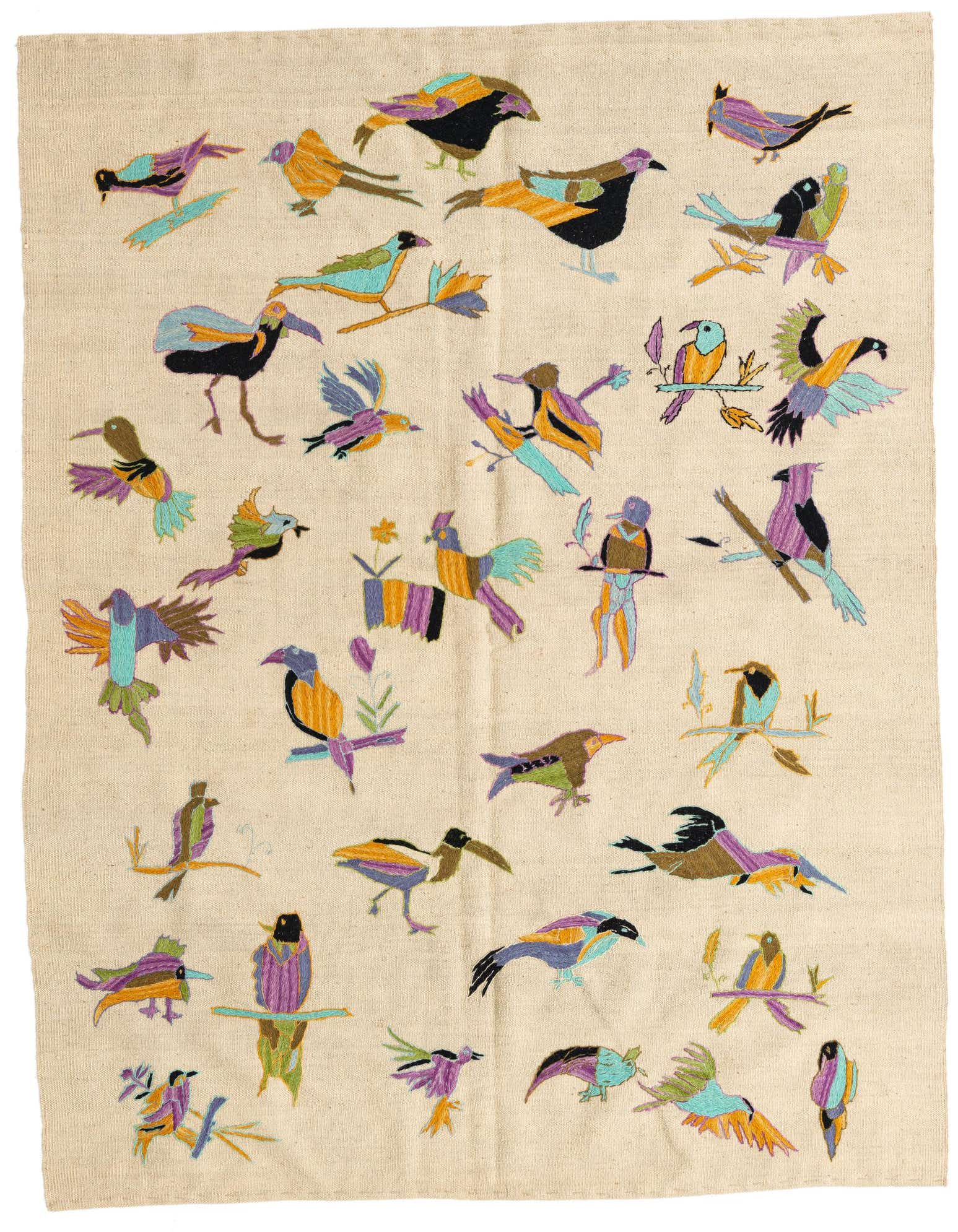 A 5x8 rectangular ivory flatweave rug featuring a vibrant, multicolored tribal bird pattern, suitable for a living room.