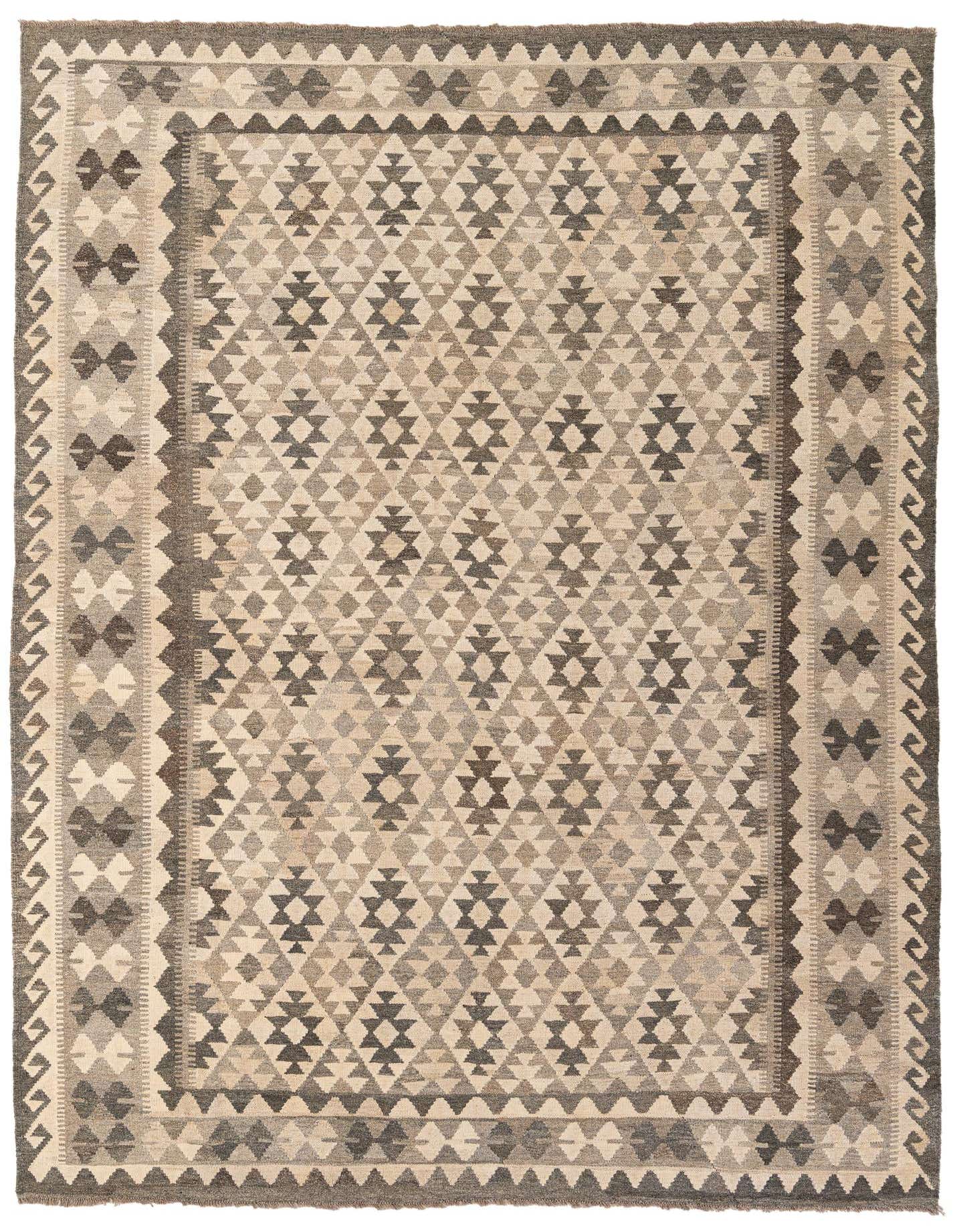 A 7x10 rectangular Kundan Kilim rug featuring a tribal geometric pattern in shades of ivory, cream, and gray.