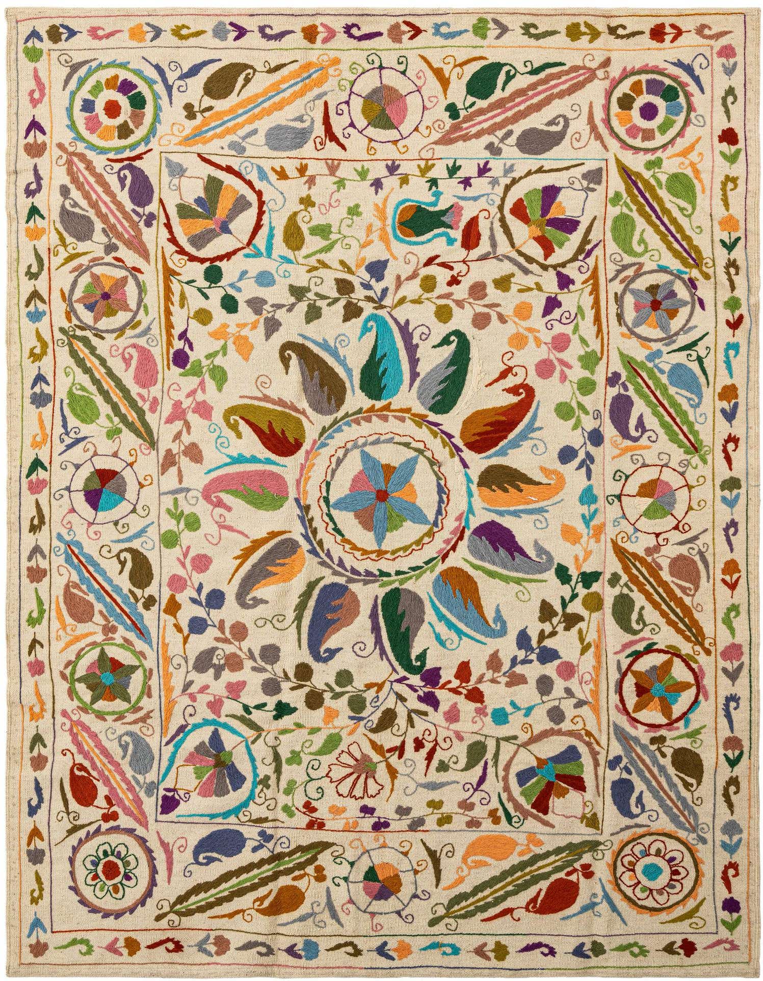 Handmade rectangular ivory wool rug with a vibrant Persian tribal pattern featuring colorful floral and paisley motifs.