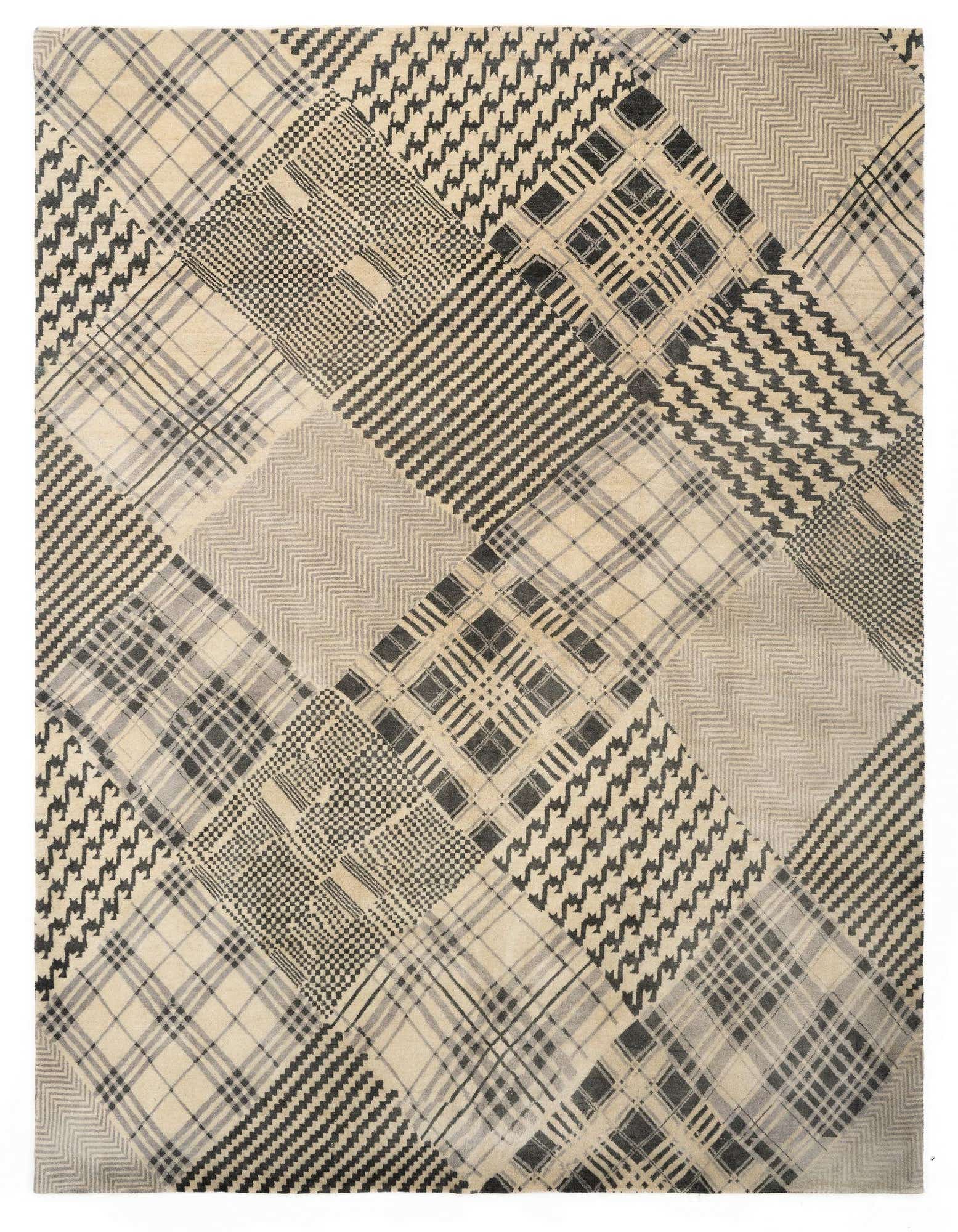 An 8x10 rectangular ivory and black wool rug featuring a modern patchwork of diverse plaid, houndstooth, and striped patterns.