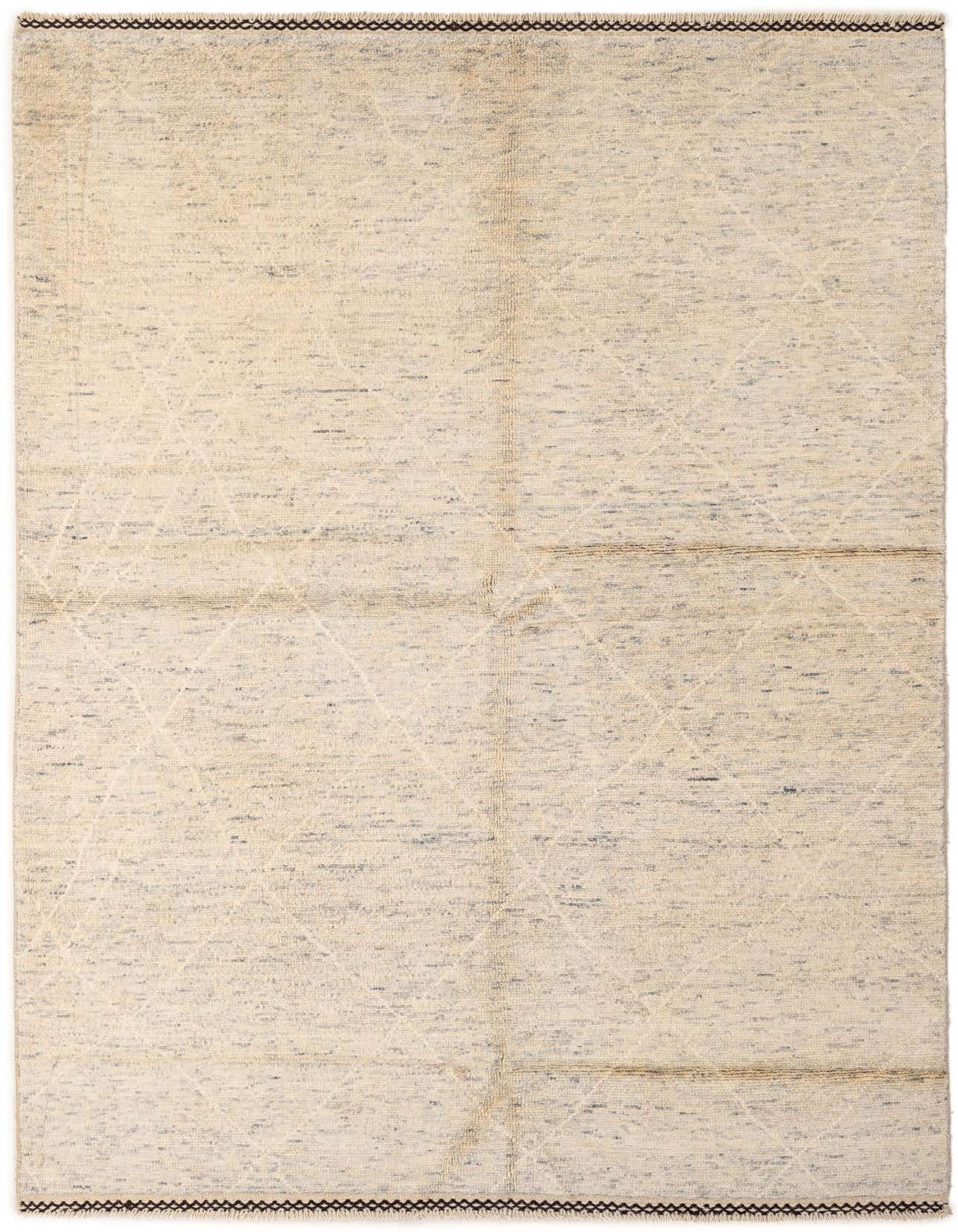 A 5x8 rectangular ivory wool rug with subtle gray tribal diamond patterns and dark brown border stitching.