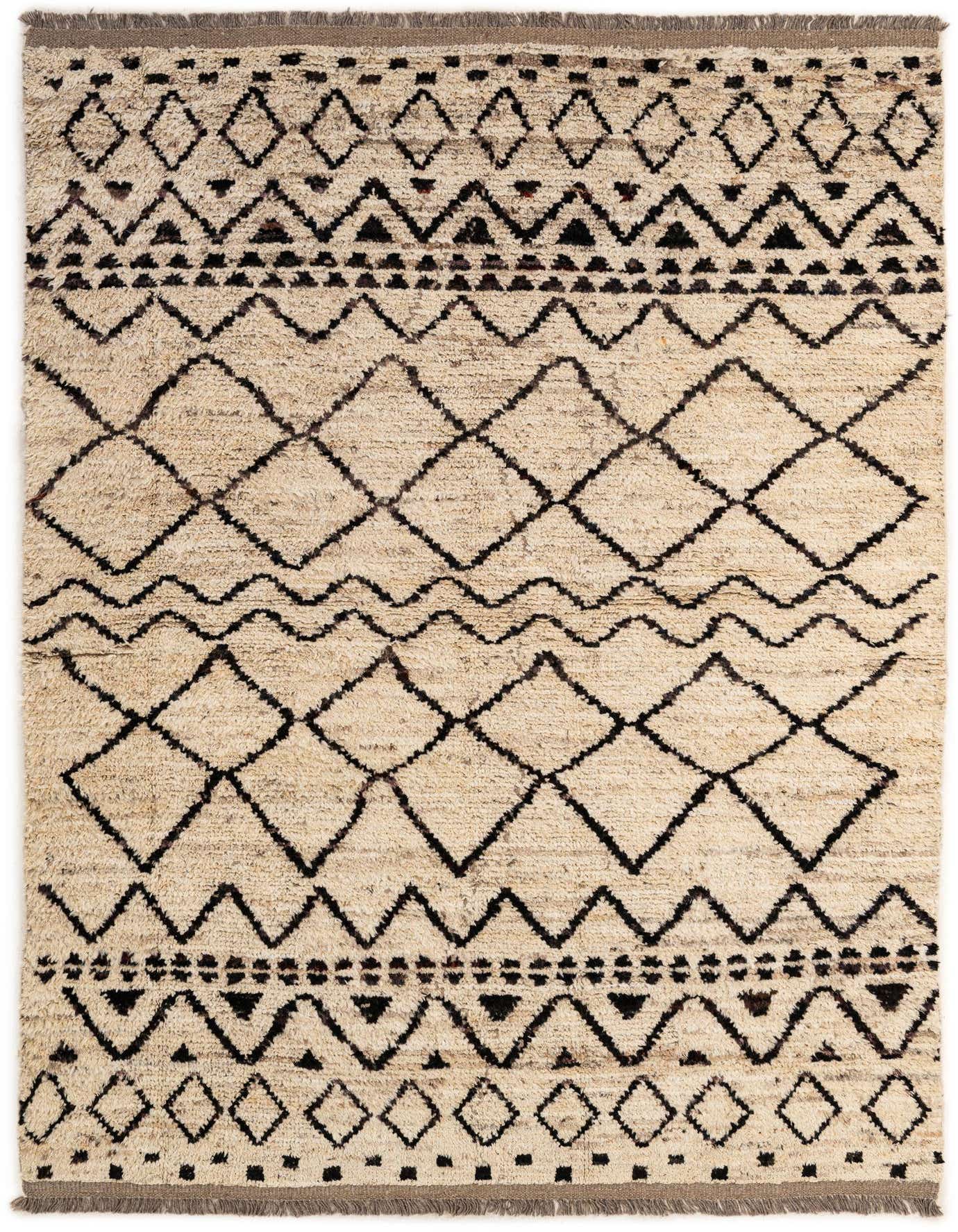 A 5x8 rectangular Moroccan rug in ivory with a tribal pattern of black diamonds, zigzags, and triangles.