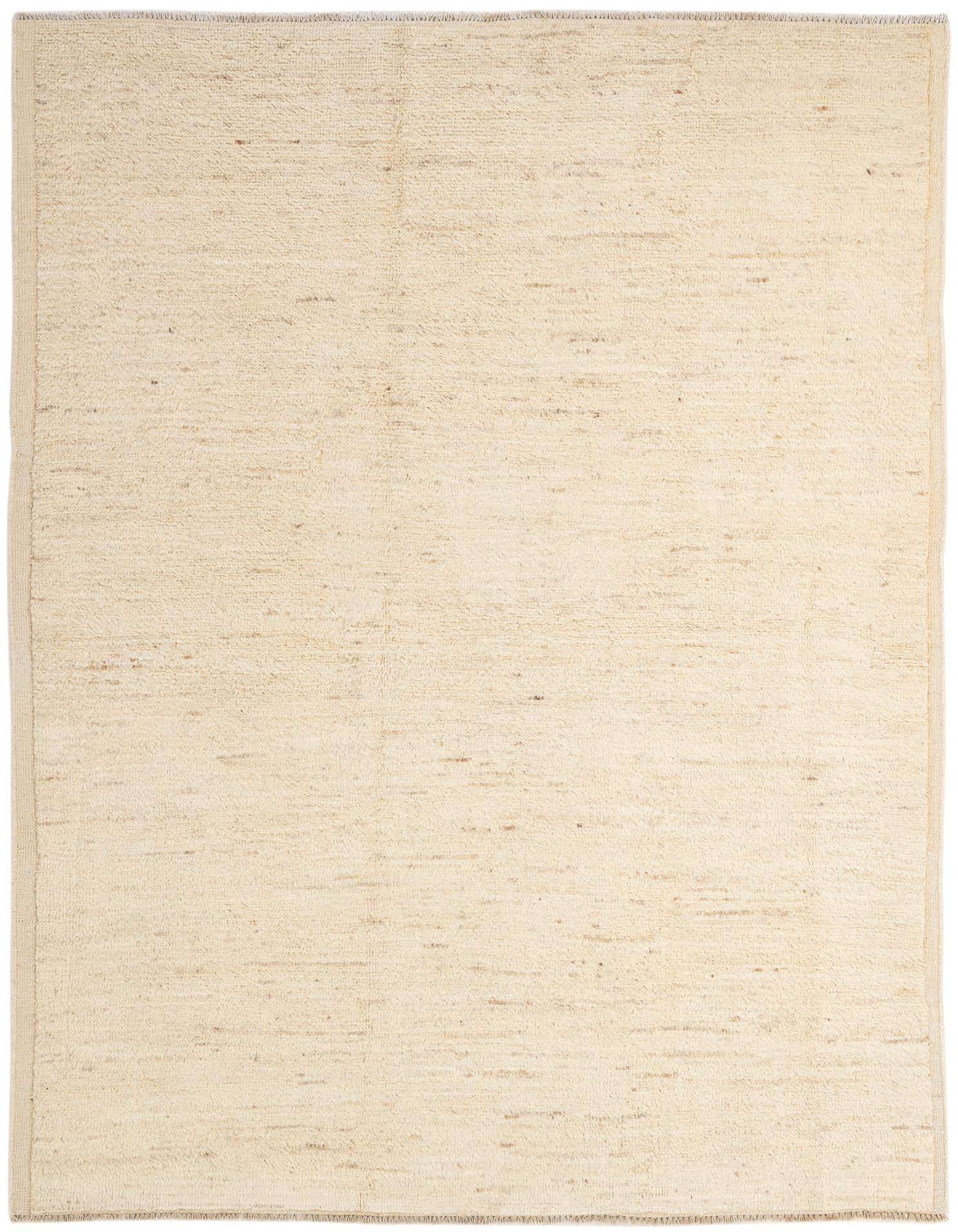 A 5x8 rectangular ivory wool rug with a subtle tribal texture, suitable for a modern living room.