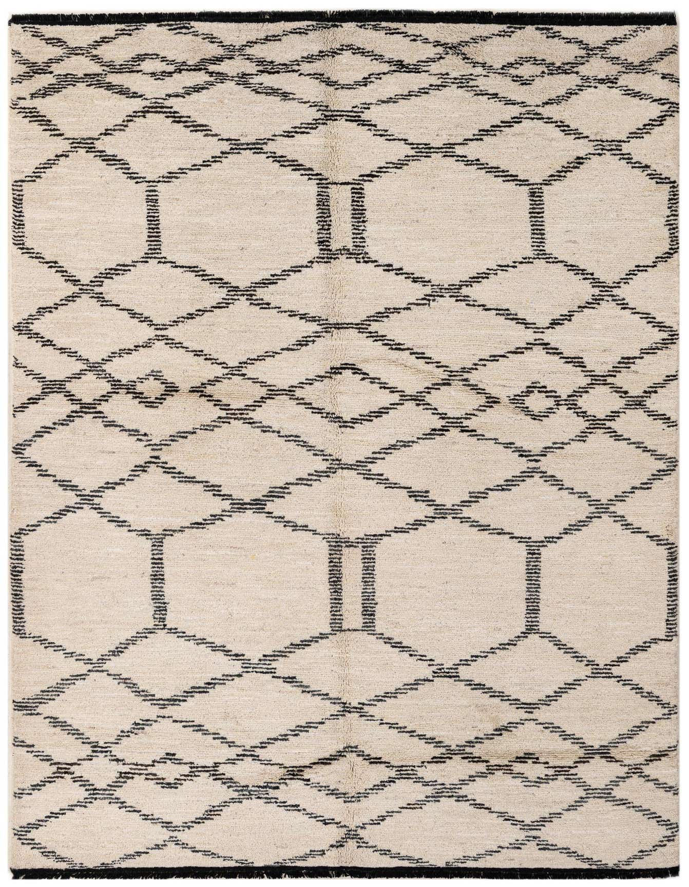 A 5x8 rectangular ivory wool rug with a black tribal geometric pattern, suitable for a living room.