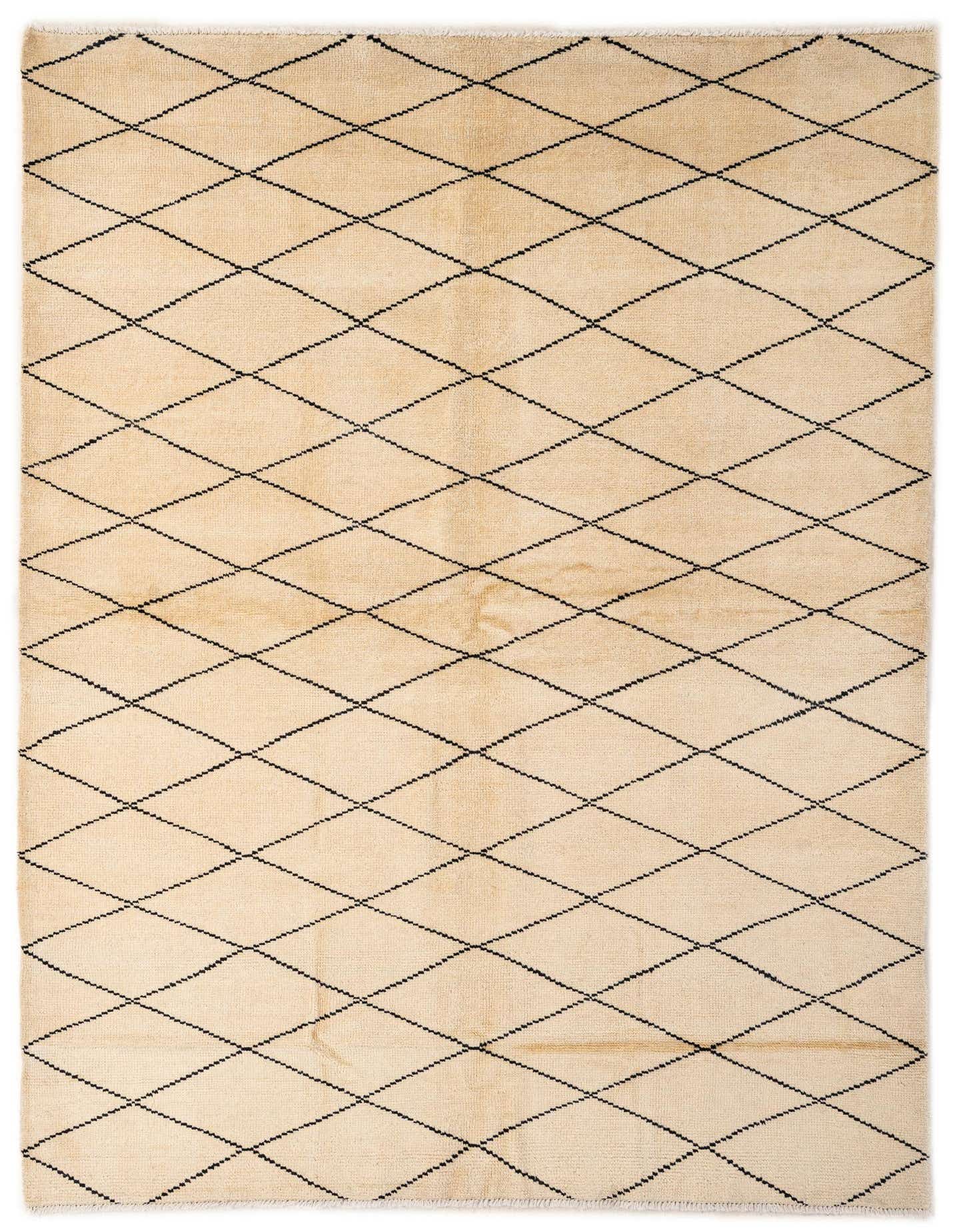 A 5x8 rectangular ivory wool rug with a black tribal diamond pattern, perfect for a living room.