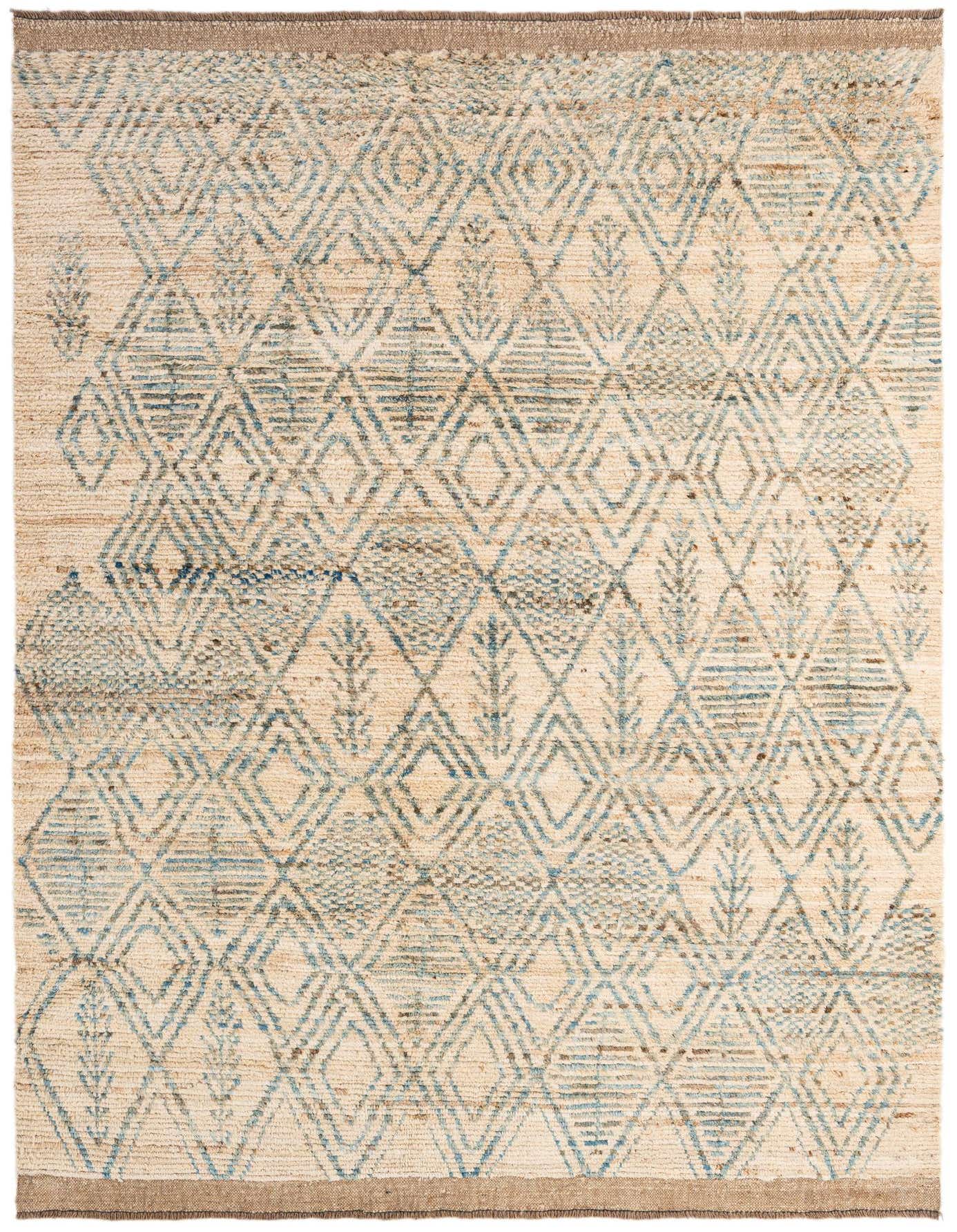A 6x9 rectangular ivory wool rug with a tribal geometric pattern in muted blue and brown tones.