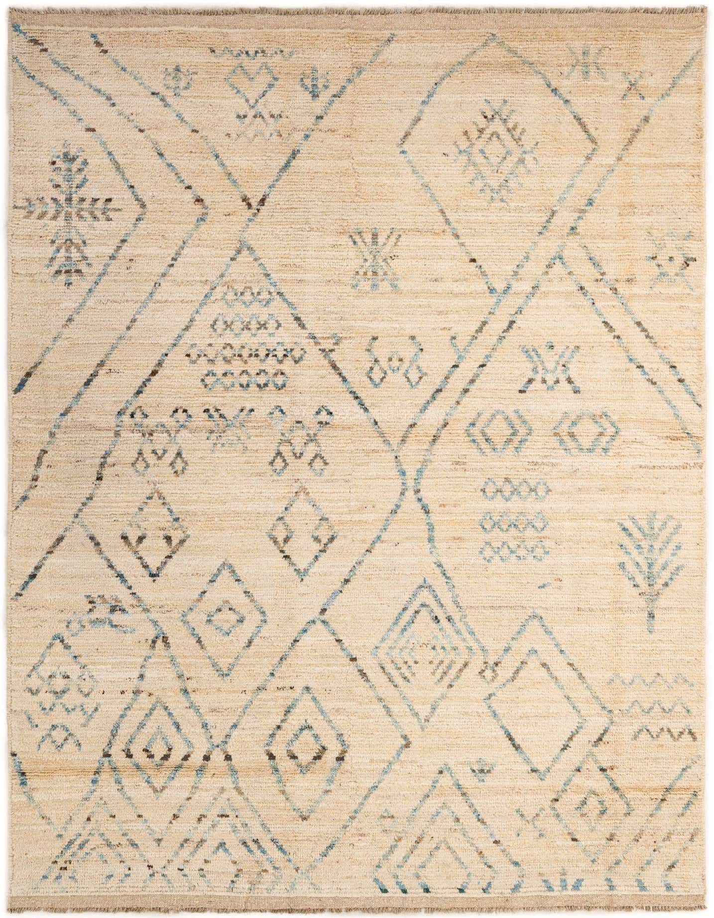 A 6x9 rectangular ivory wool rug with a tribal modern pattern featuring blue and brown geometric shapes.