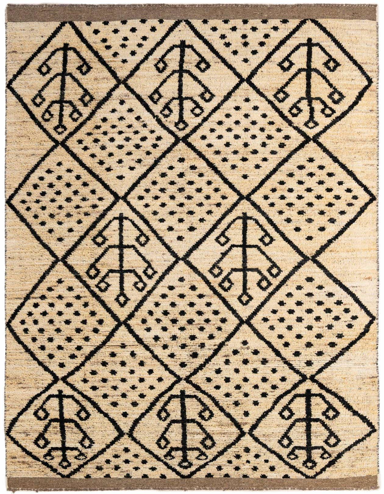A 6x9 rectangular ivory wool rug with a black tribal diamond pattern and dotted accents, suitable for a living room.