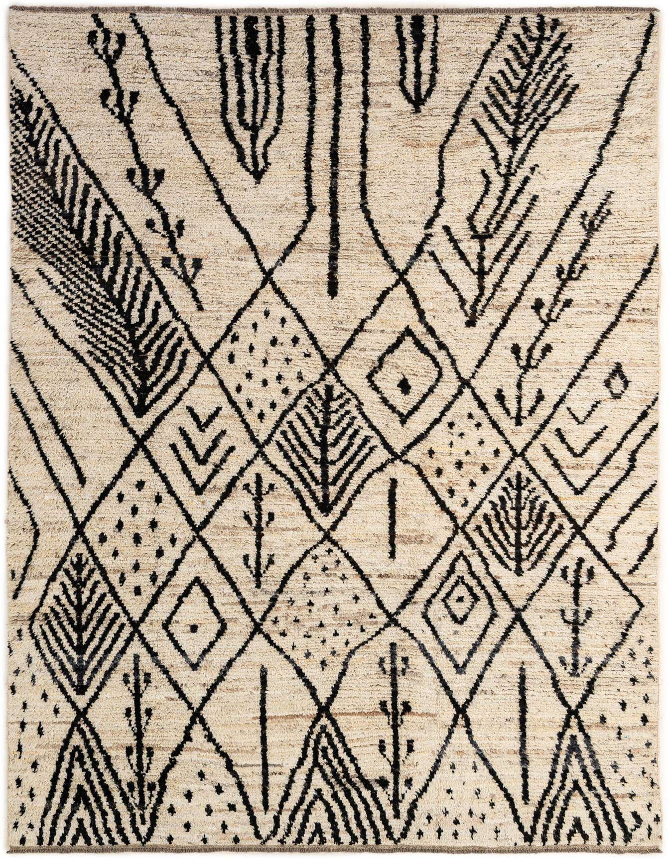 A 6x9 rectangular ivory wool rug with a black tribal geometric pattern, featuring diamonds and abstract leaf-like motifs.