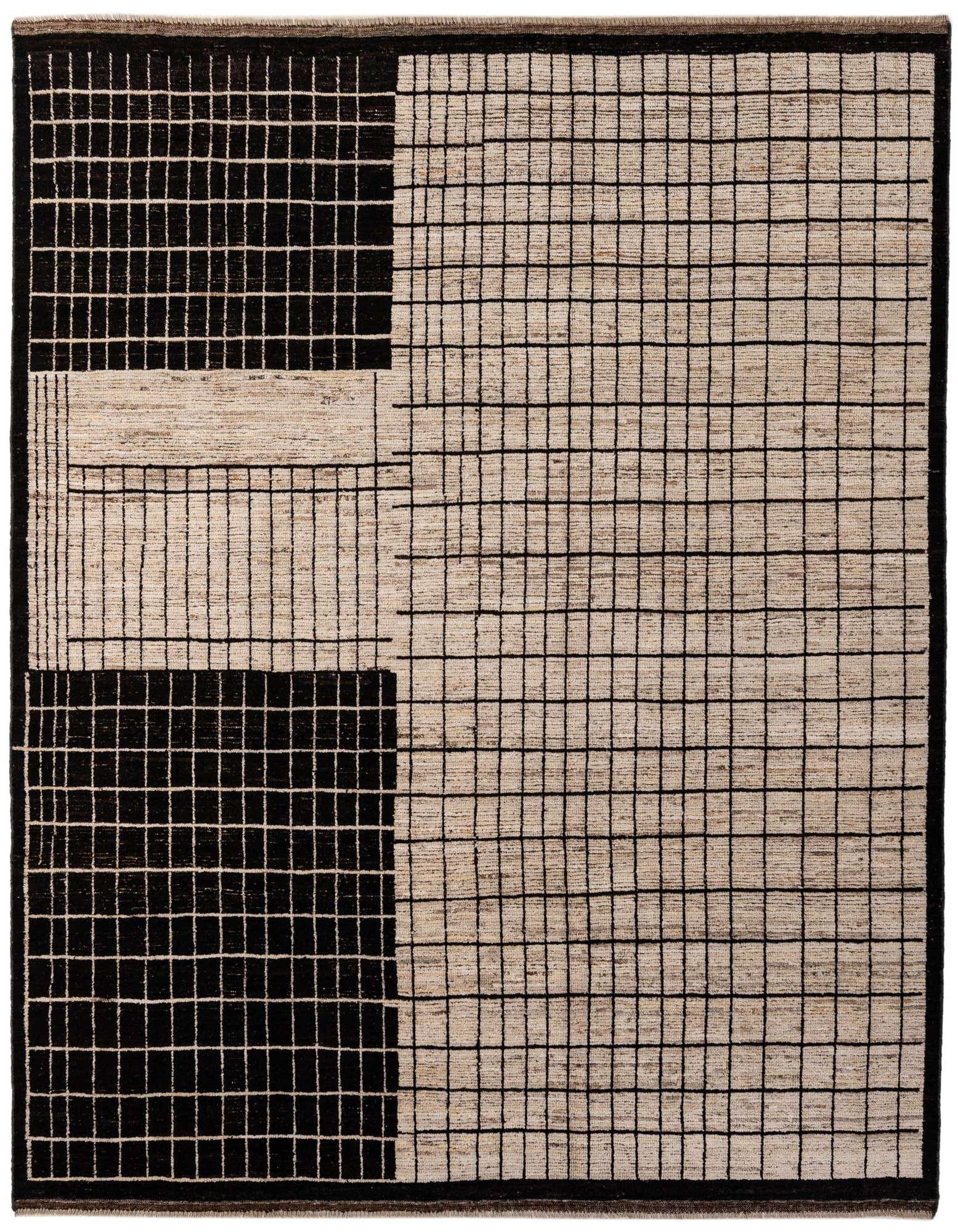 An 8x10 rectangular ivory and black wool rug with a modern tribal grid pattern, featuring large black squares with white grids and ivory sections with black grids.