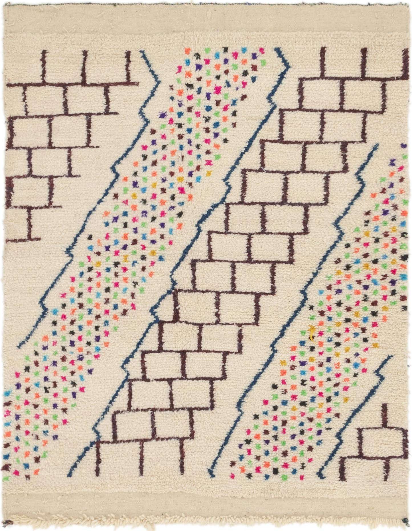 A 4x6 rectangular ivory shag rug with a modern tribal pattern of brown brick-like shapes and colorful confetti dots.