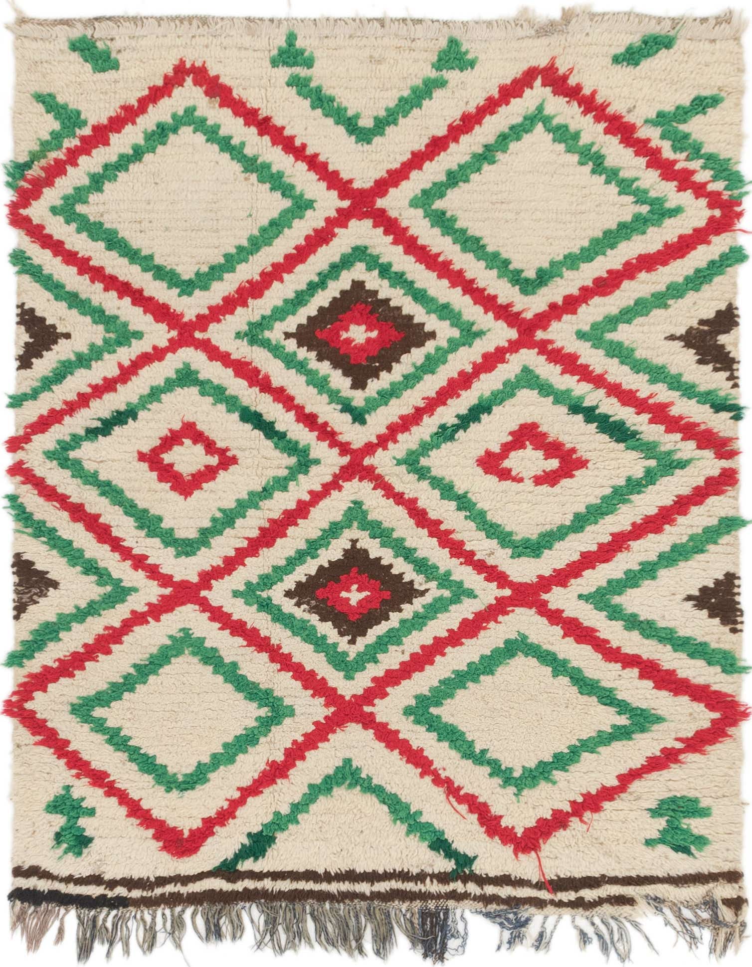 A 4x6 rectangular ivory shag rug featuring a bold Southwestern geometric pattern with red, green, and brown diamonds.