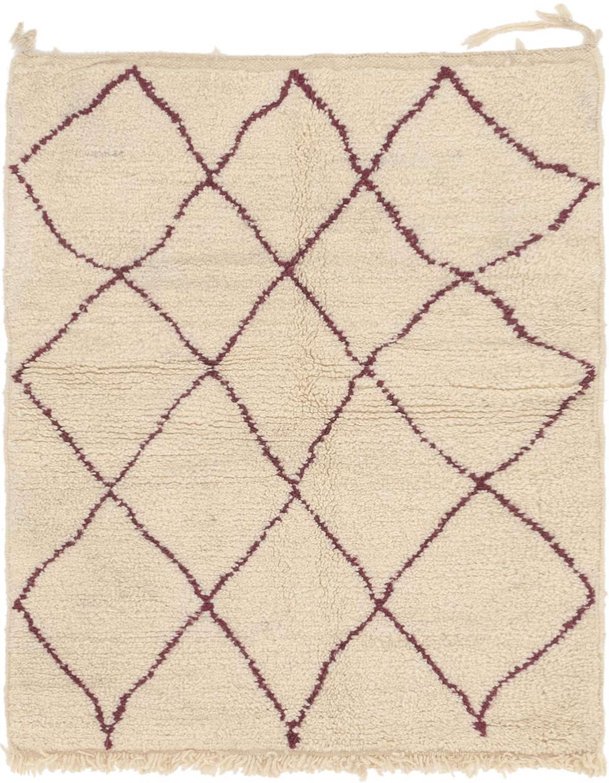 A 3x5 rectangular ivory shag rug with a bold, irregular maroon tribal diamond pattern and fringed edges.