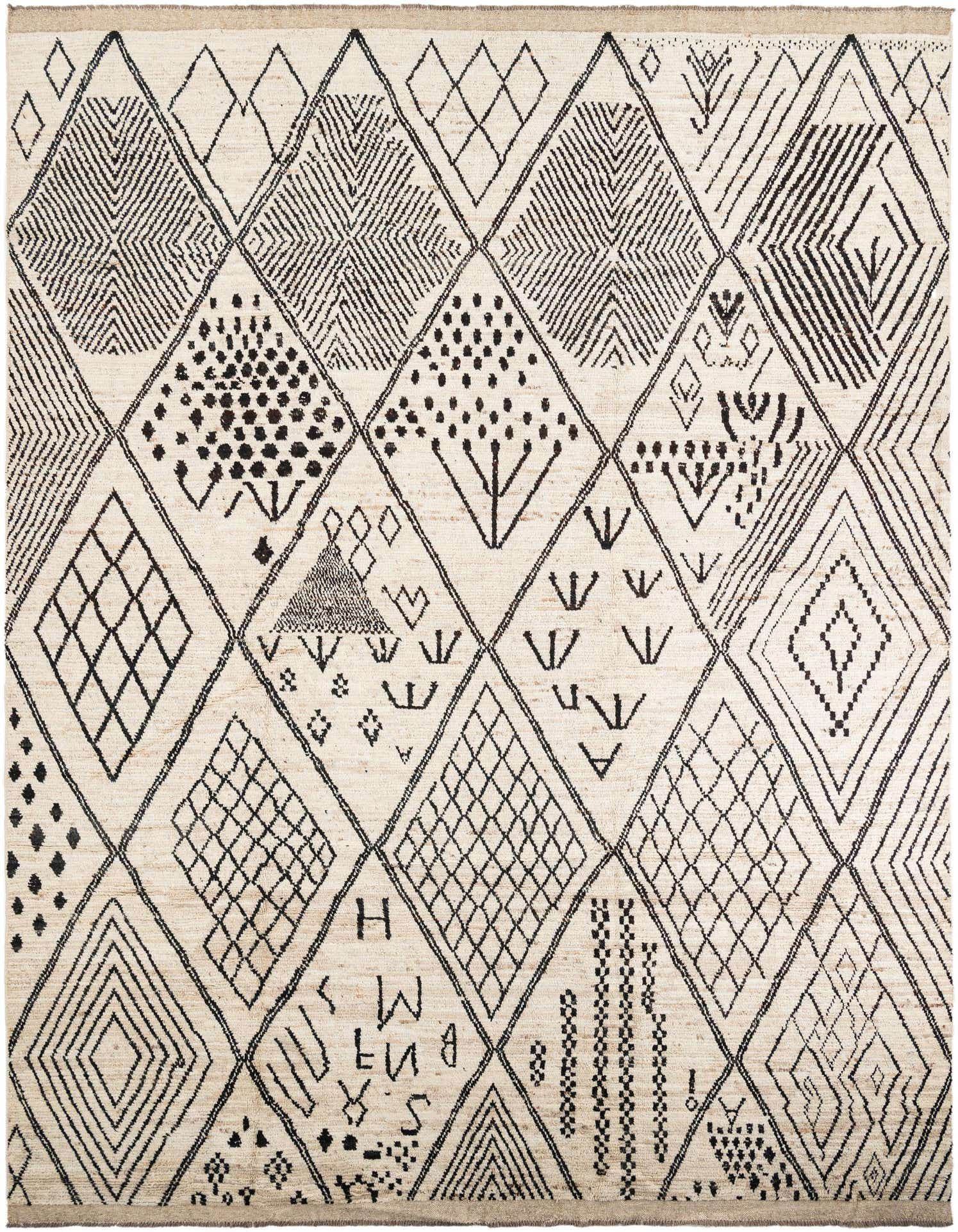A 10x14 rectangular ivory wool shag rug with a bold black tribal diamond and abstract pattern.