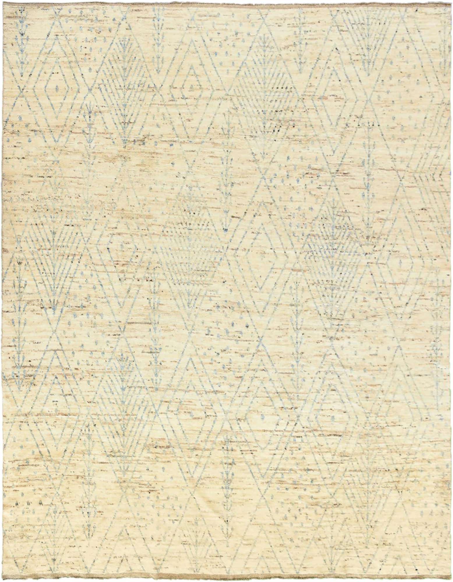 A large 13x18 rectangular ivory wool shag rug with a light blue tribal diamond and abstract pattern.