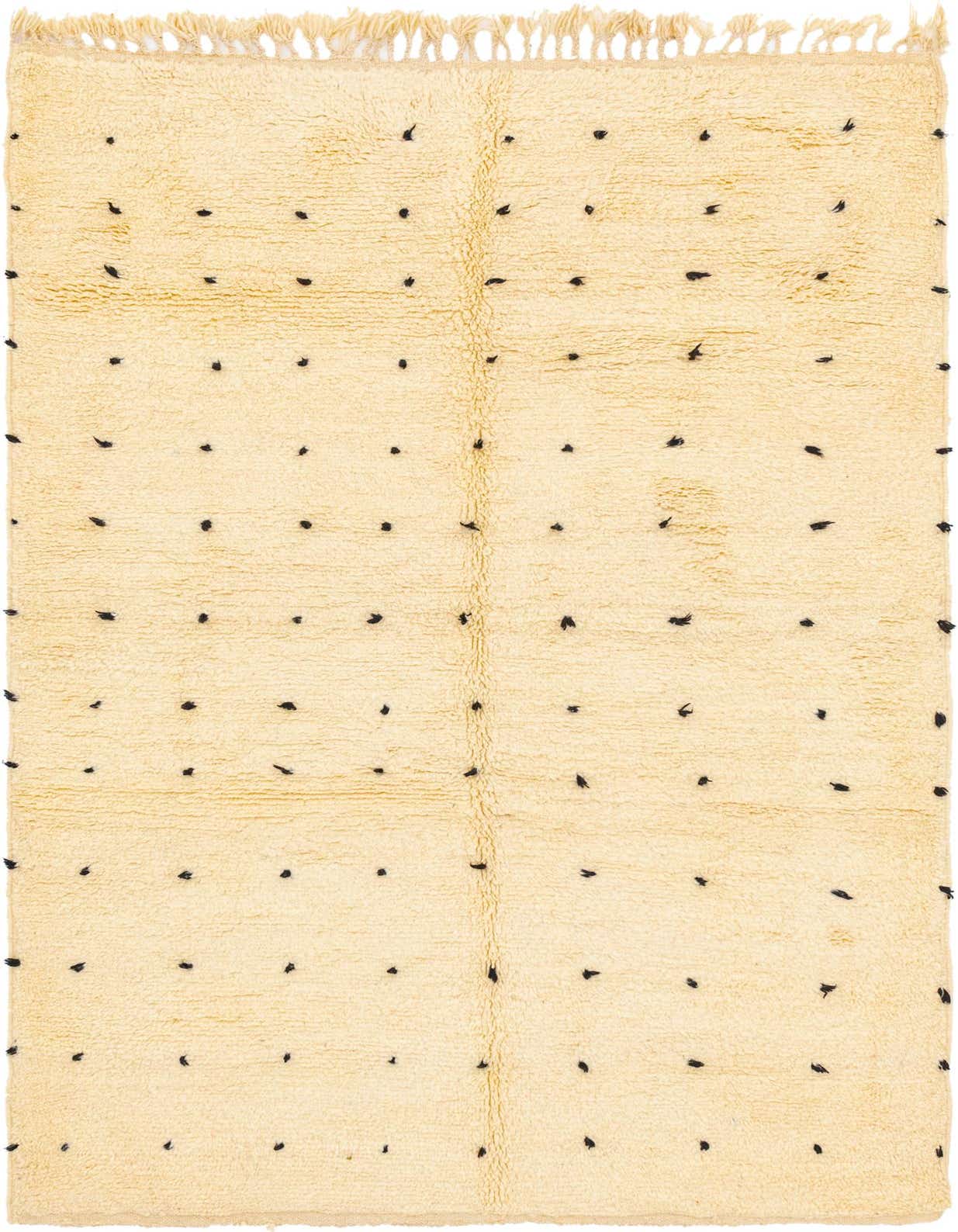 A 5x8 rectangular ivory shag rug with small, irregularly spaced black dots, featuring fringe on one end.