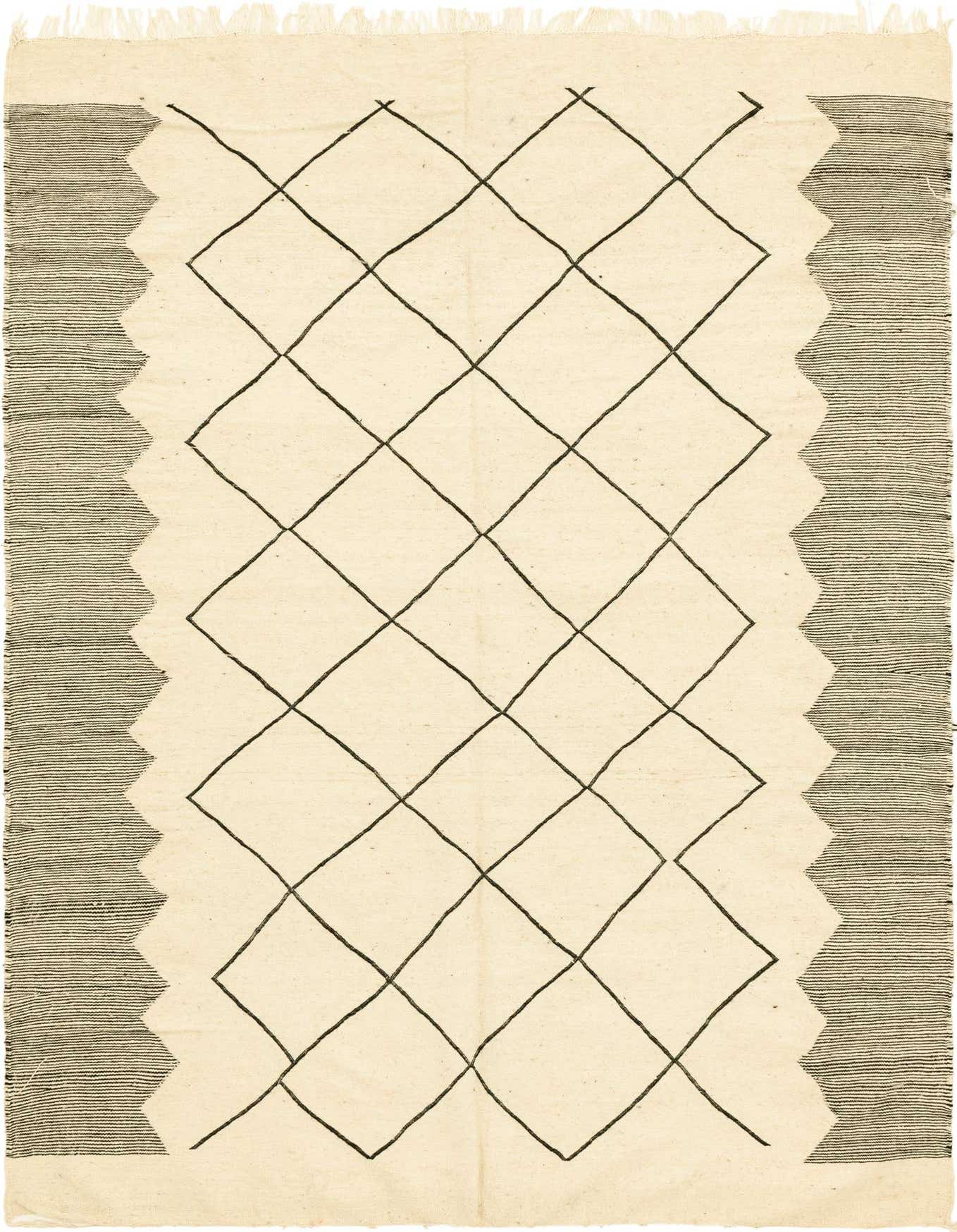 A 6x9 rectangular ivory wool shag rug with a black tribal diamond pattern and striped borders.
