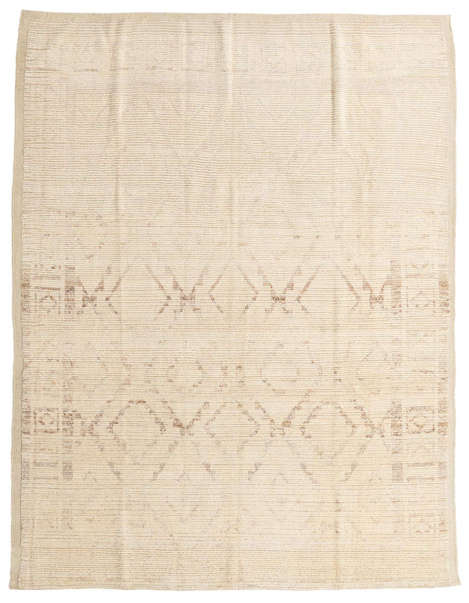 An 8x10 rectangular ivory wool shag rug with subtle brown tribal patterns, ideal for a living room.