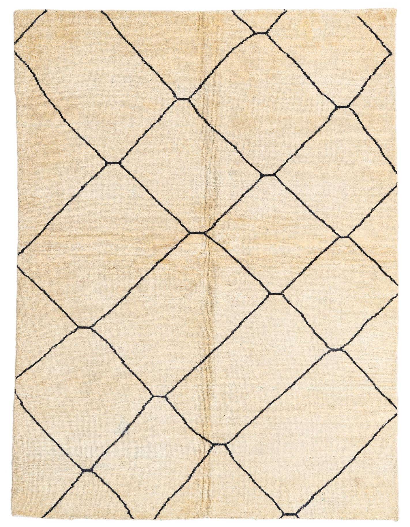 A 5x8 rectangular ivory shag rug with a black tribal diamond pattern, perfect for a living room.