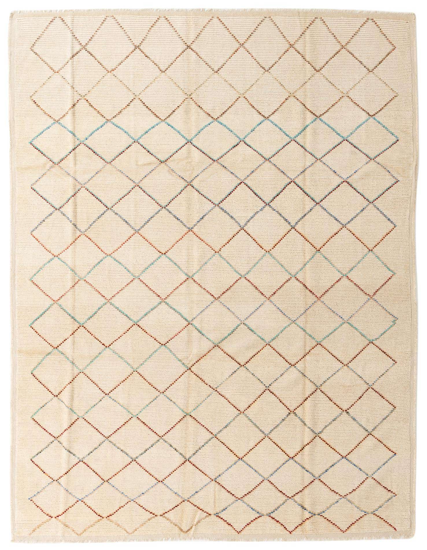 A 10x13 rectangular ivory shag rug with a modern tribal diamond pattern in subtle blue, red, and brown lines.