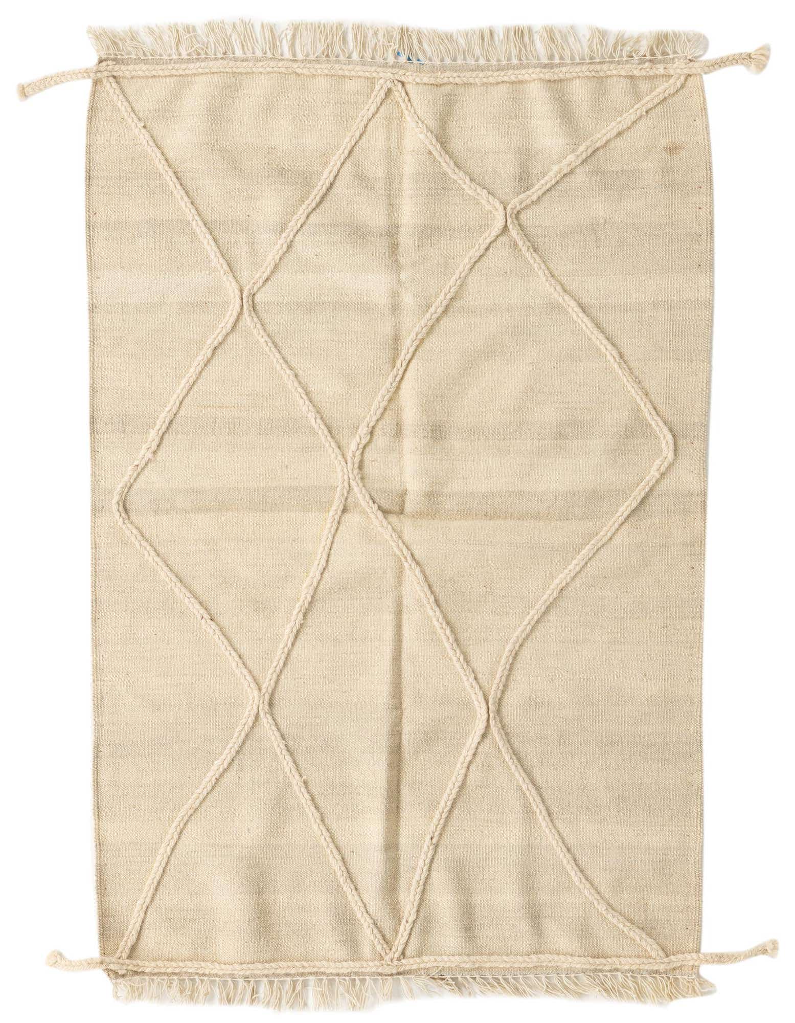 A 3x5 rectangular ivory wool shag rug with a modern tribal diamond pattern made from braided rope, featuring fringe ends.