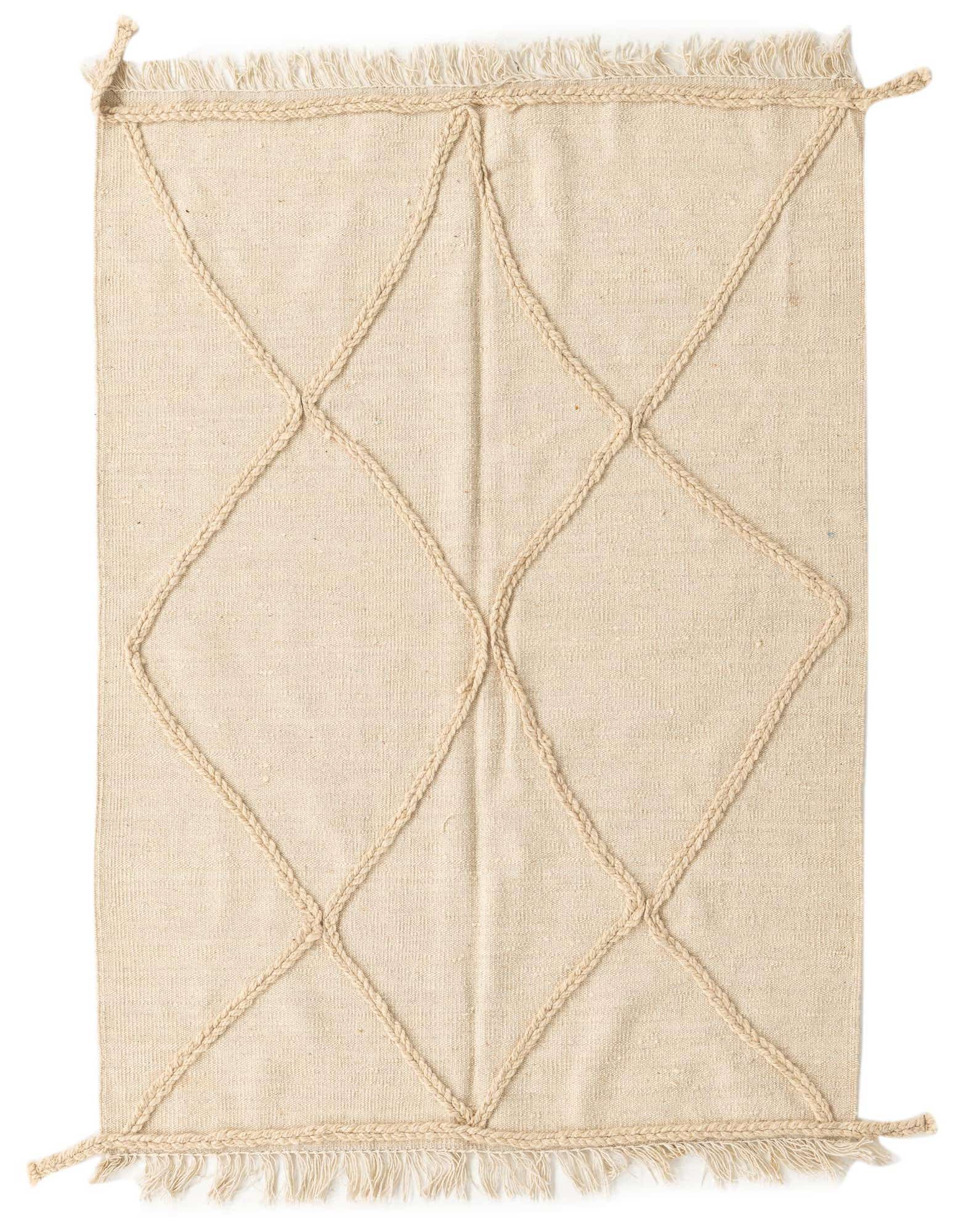 A 3x5 rectangular ivory wool shag rug with a raised braided diamond tribal pattern and fringed edges.