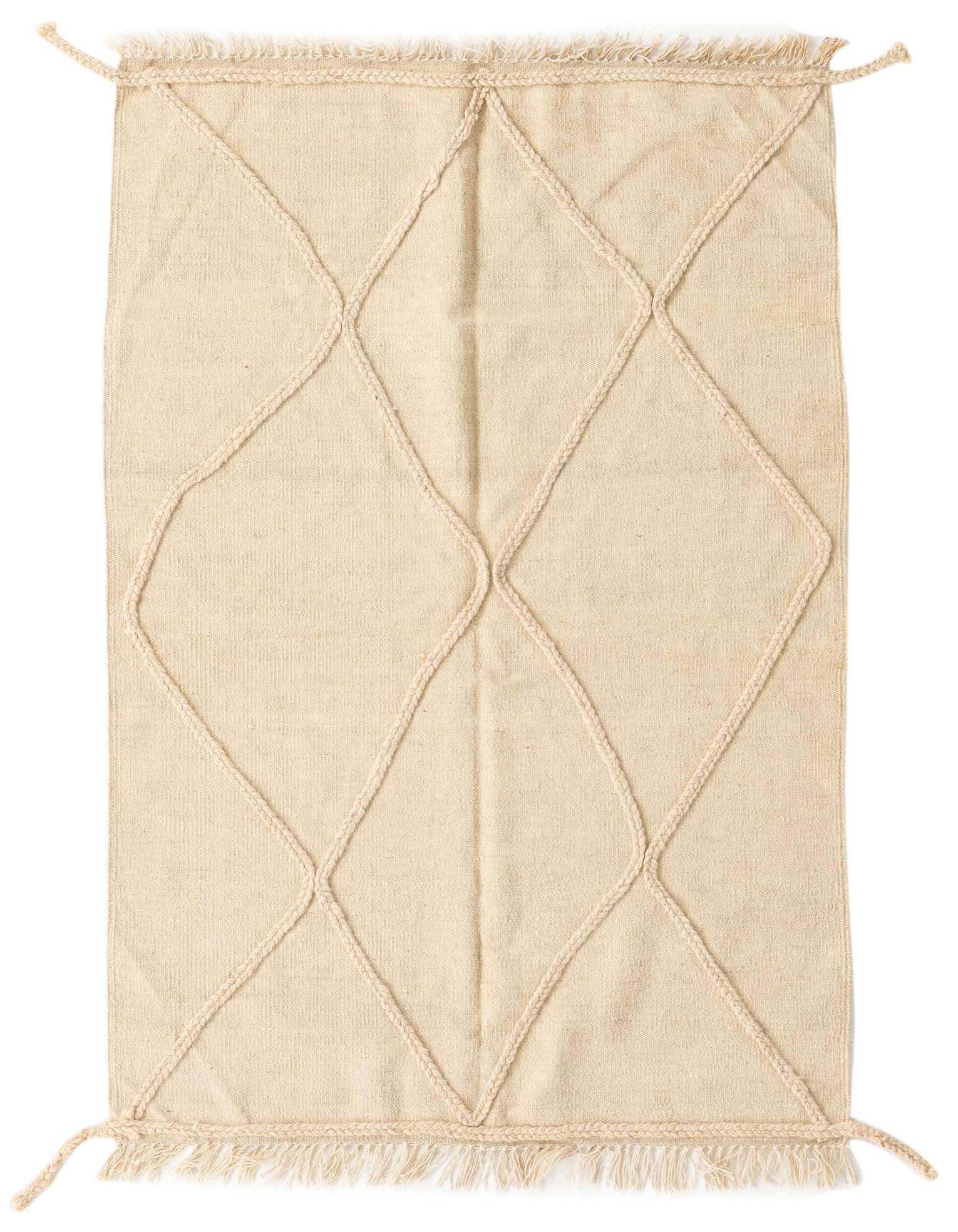 A 3x5 rectangular ivory wool shag rug with a braided diamond tribal pattern and fringed edges.
