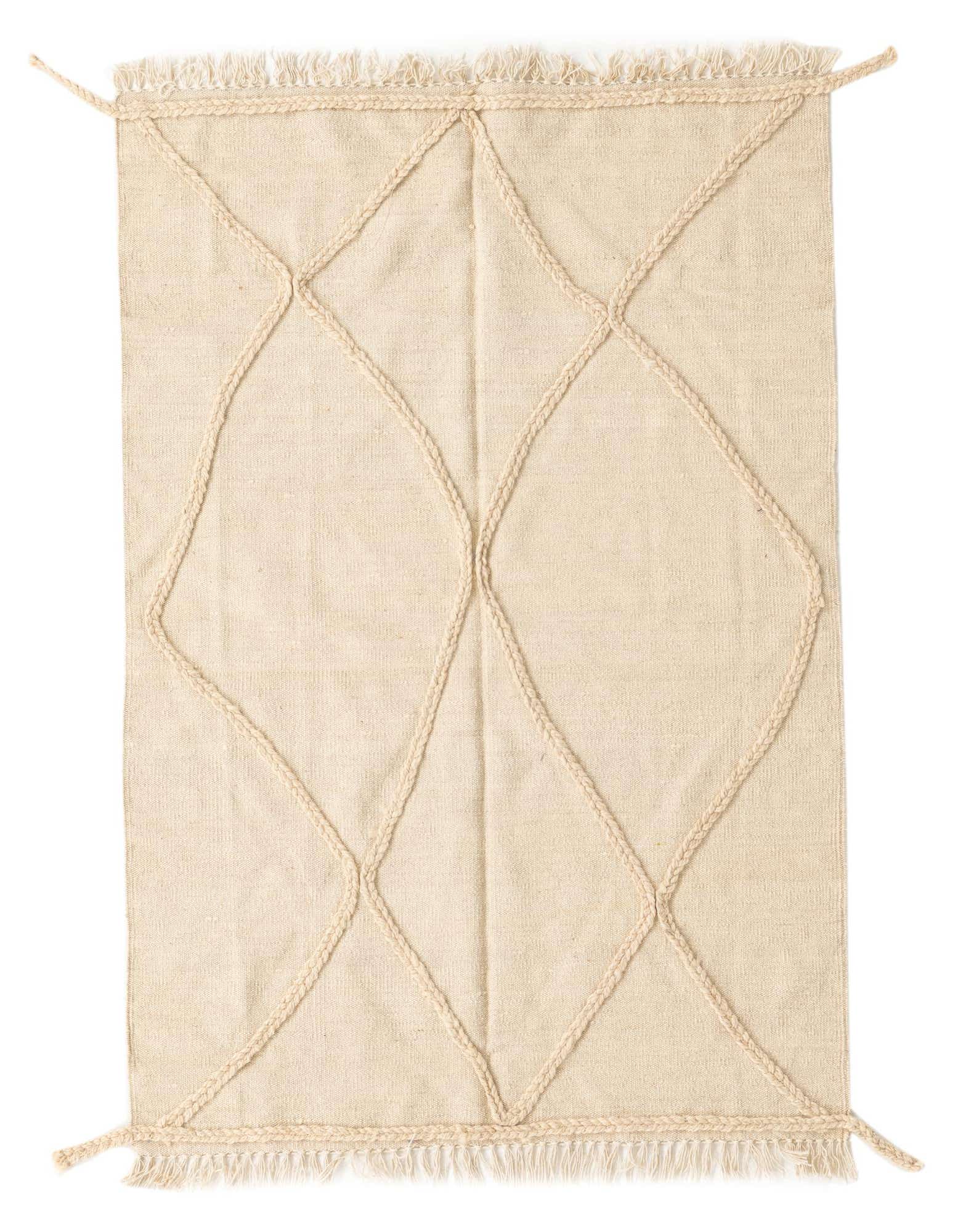 A 3x5 rectangular ivory wool shag rug with a braided diamond tribal pattern and fringed edges.
