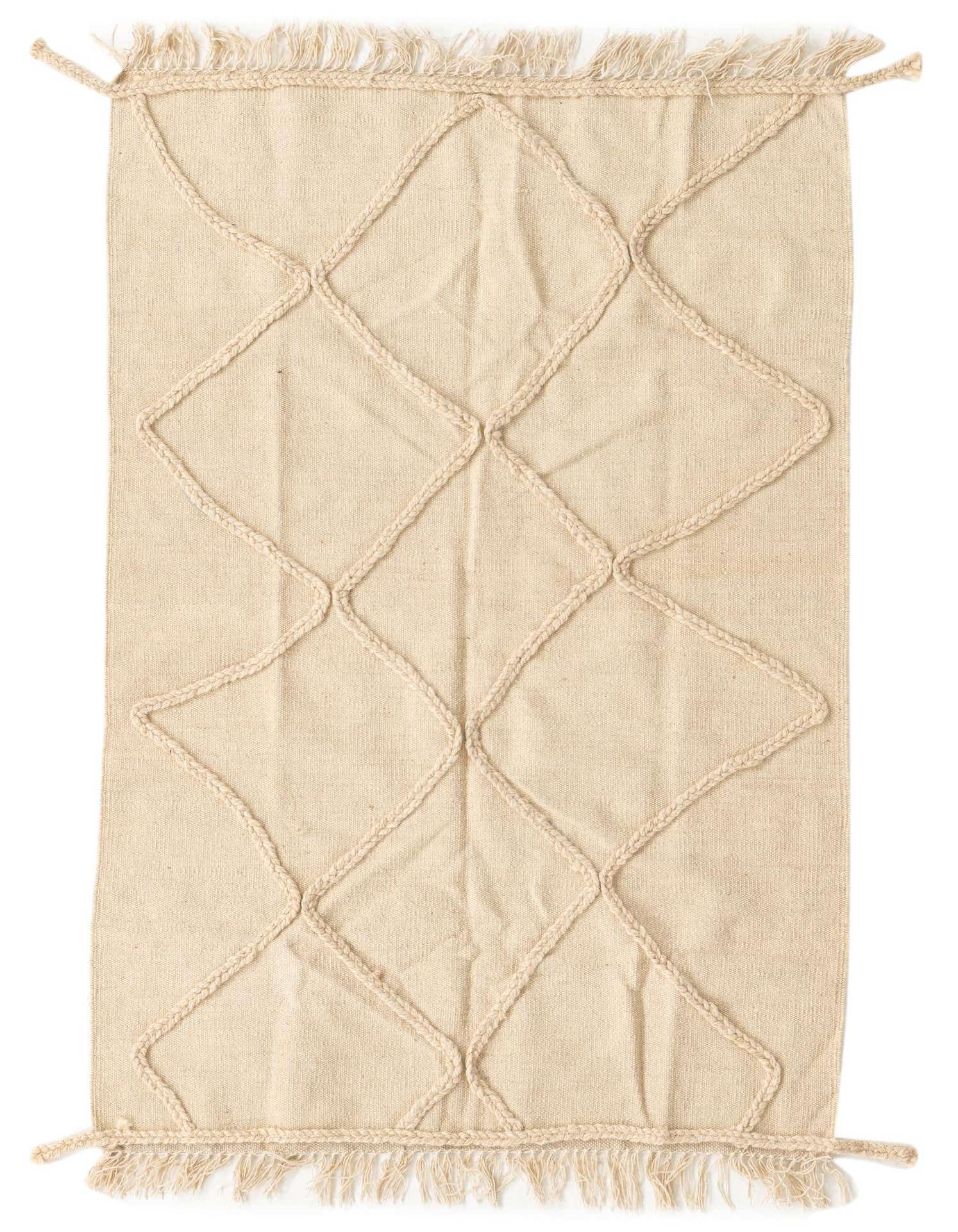 A 3x5 rectangular ivory wool shag rug with a raised braided diamond pattern and fringed ends.