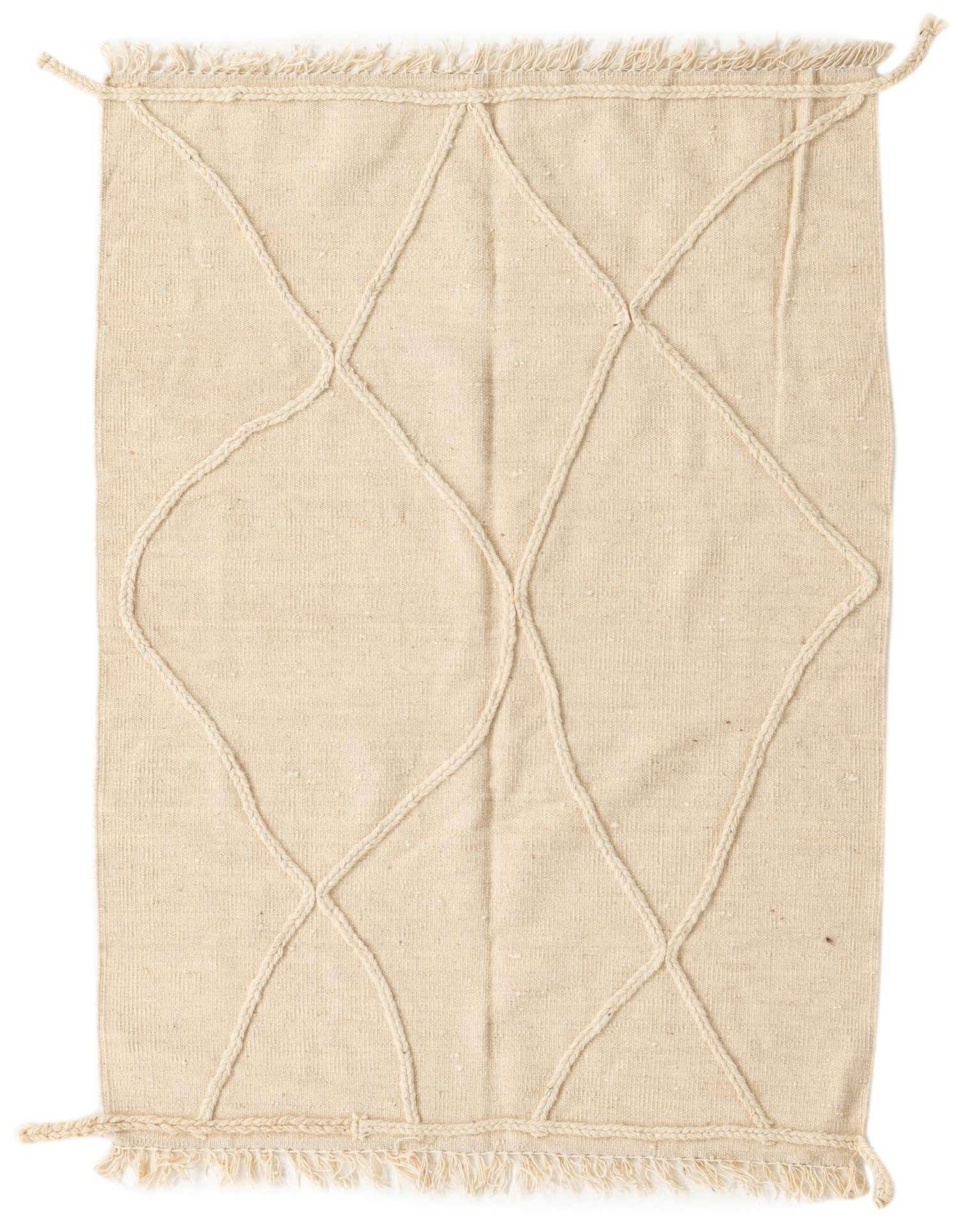A 3x5 rectangular ivory shag rug with a raised tribal diamond pattern, featuring braided edges and fringe.