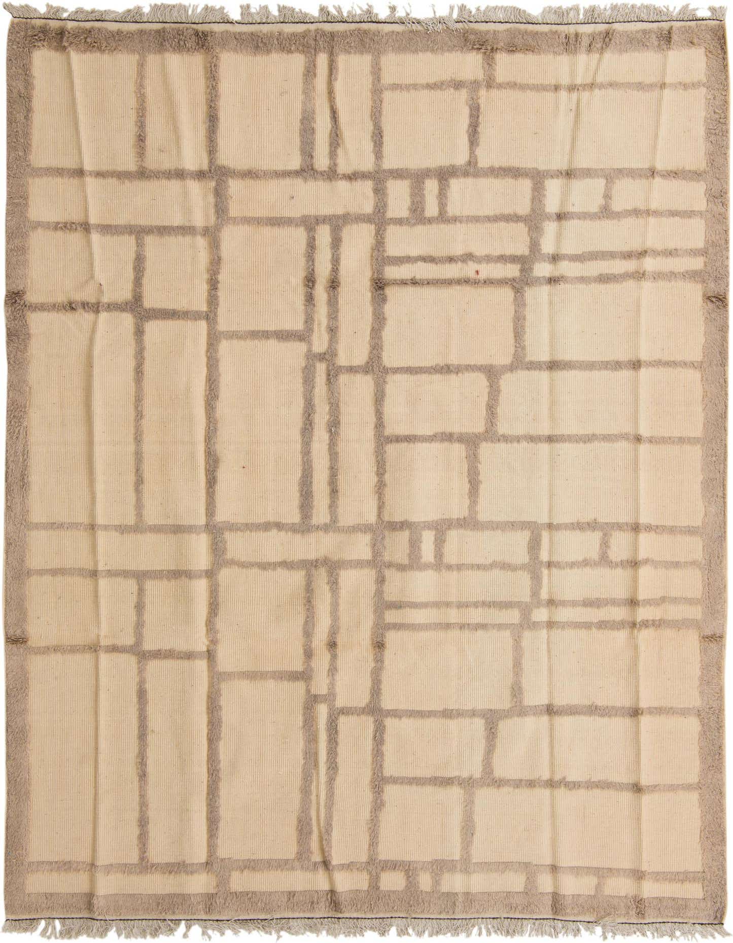 A 7x10 rectangular ivory wool shag rug with a modern tribal abstract pattern in muted cream tones, featuring a textured border.