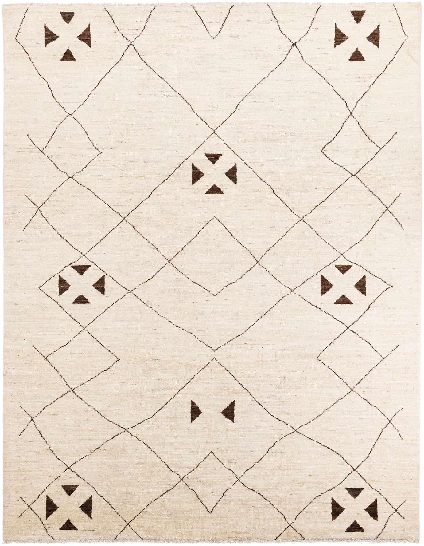 An 8x11 rectangular ivory wool shag rug with a modern tribal pattern of dark brown diamonds and geometric shapes.