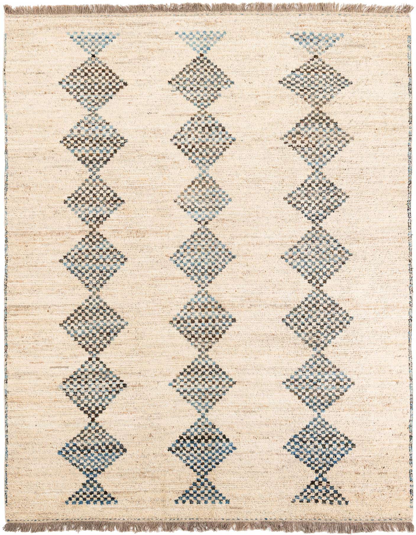 A 7x10 rectangular ivory wool shag rug with a tribal pattern of alternating blue and brown diamond shapes.