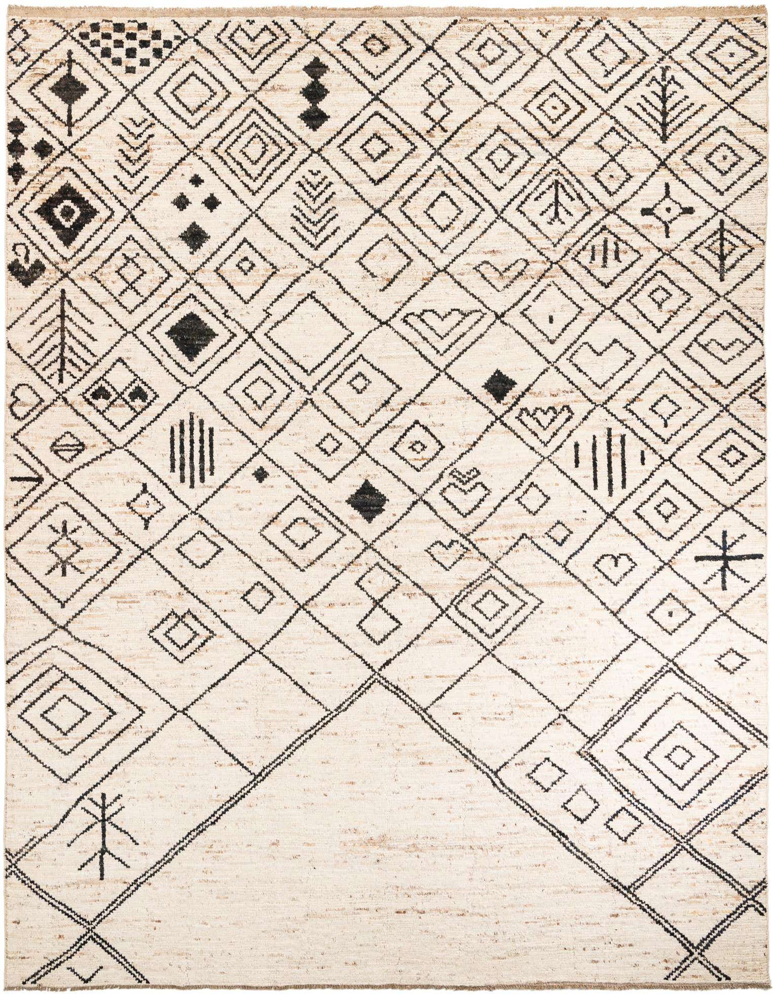 A 10x14 rectangular ivory shag rug with a modern tribal pattern of black geometric shapes and lines.
