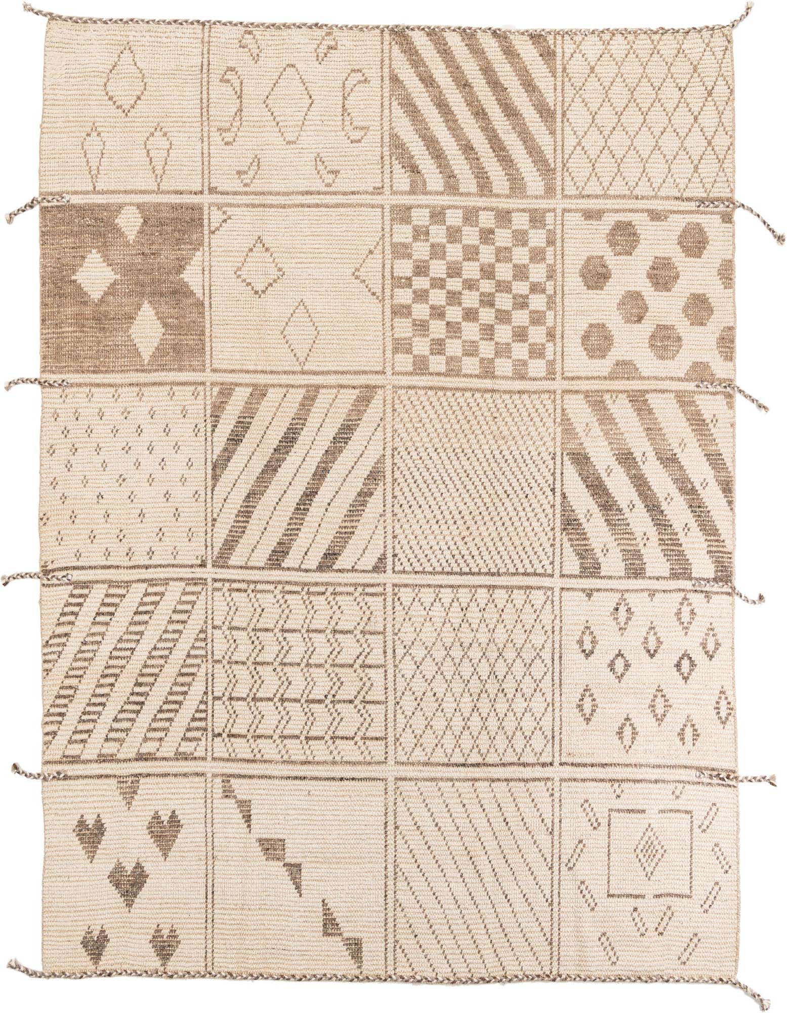 An 8x10 rectangular ivory wool shag rug featuring a modern tribal patchwork design with various geometric patterns in cream and light brown.