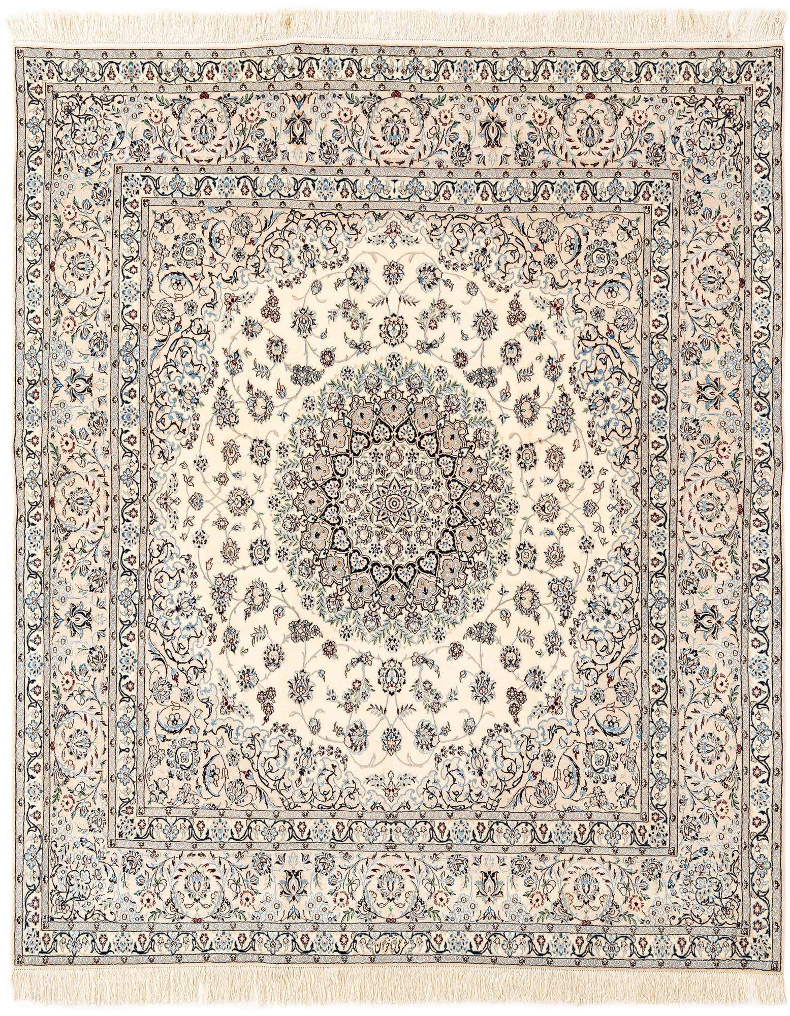 A rectangular handmade ivory Persian rug with intricate floral motifs and a central medallion, featuring cream, blue, and brown accents.
