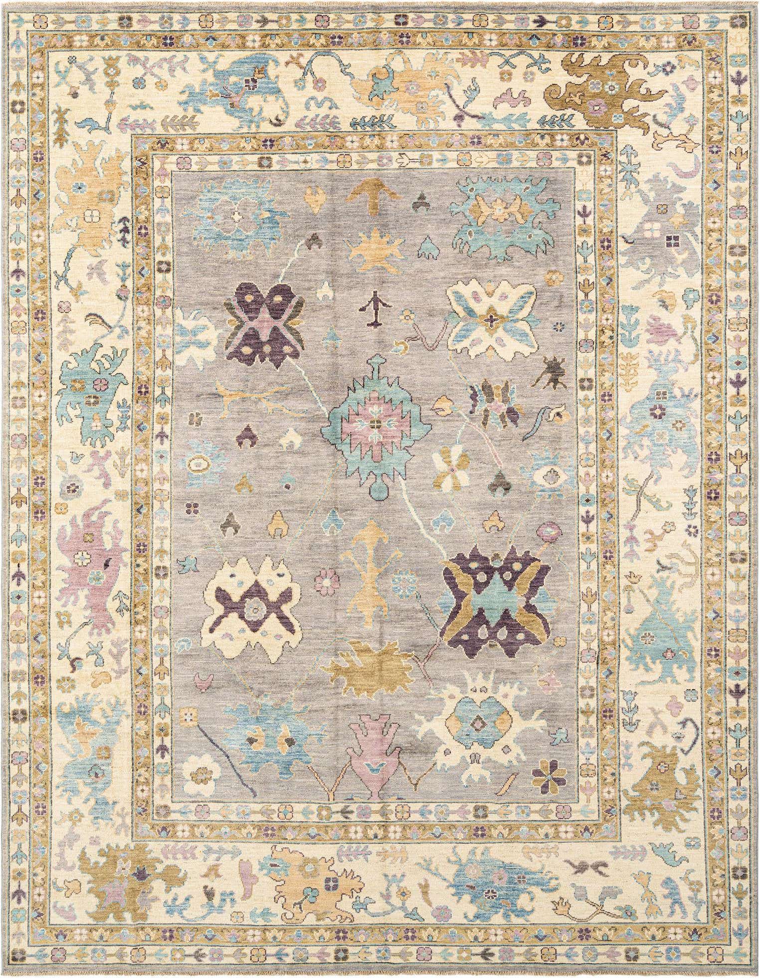 A handmade rectangular Oushak Persian rug featuring a cream border and a gray center with intricate floral and medallion patterns in blue, gold, purple, and pink.