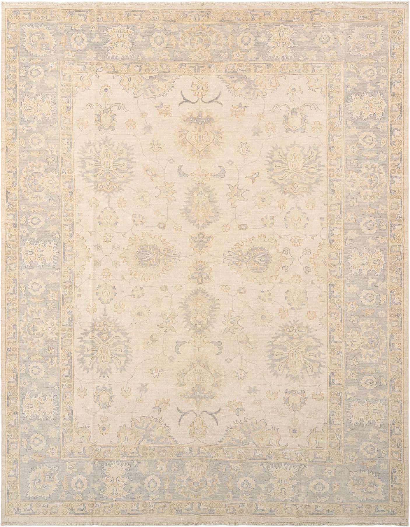 A rectangular Oushak Persian rug with an ivory field and light blue and gold floral patterns, featuring a detailed border.