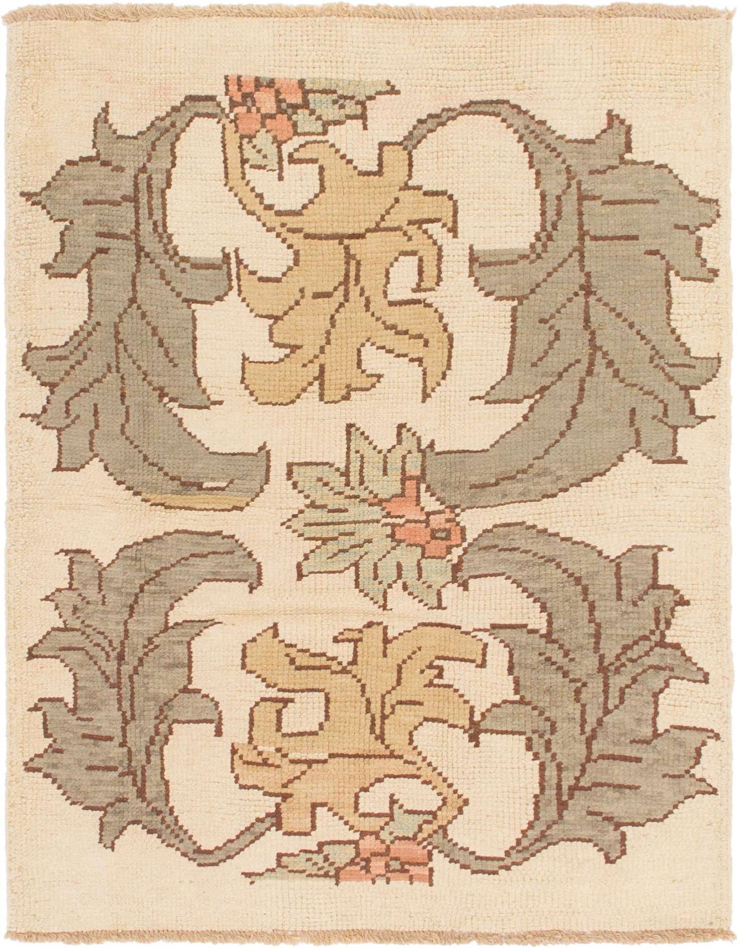 A 4x6 rectangular ivory wool rug with a tribal abstract pattern of large sage green and gold leaves and small peach flowers.