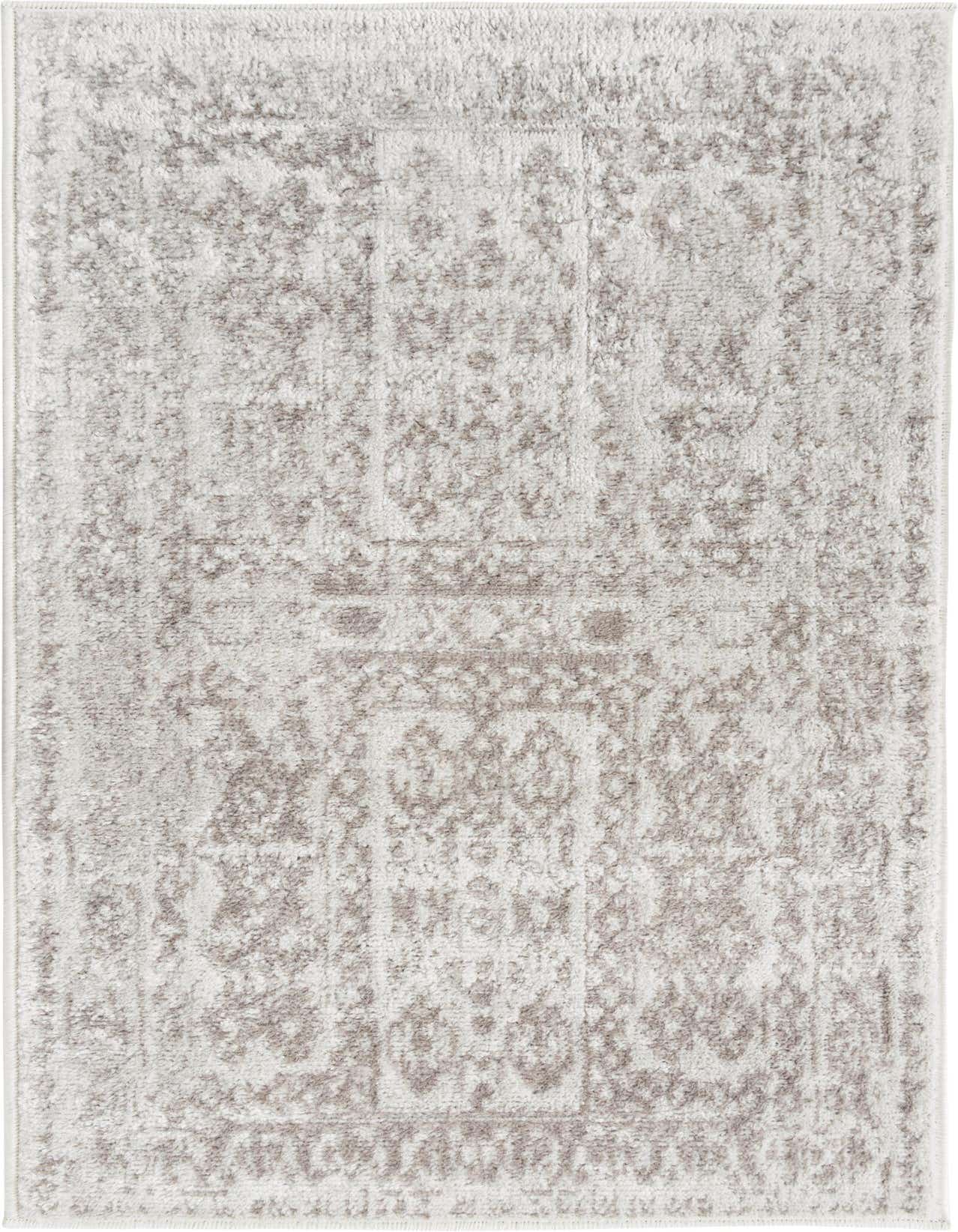 A 2x3 rectangular Oxford collection rug in ivory and cream with a distressed bohemian and traditional pattern, suitable for an entryway.