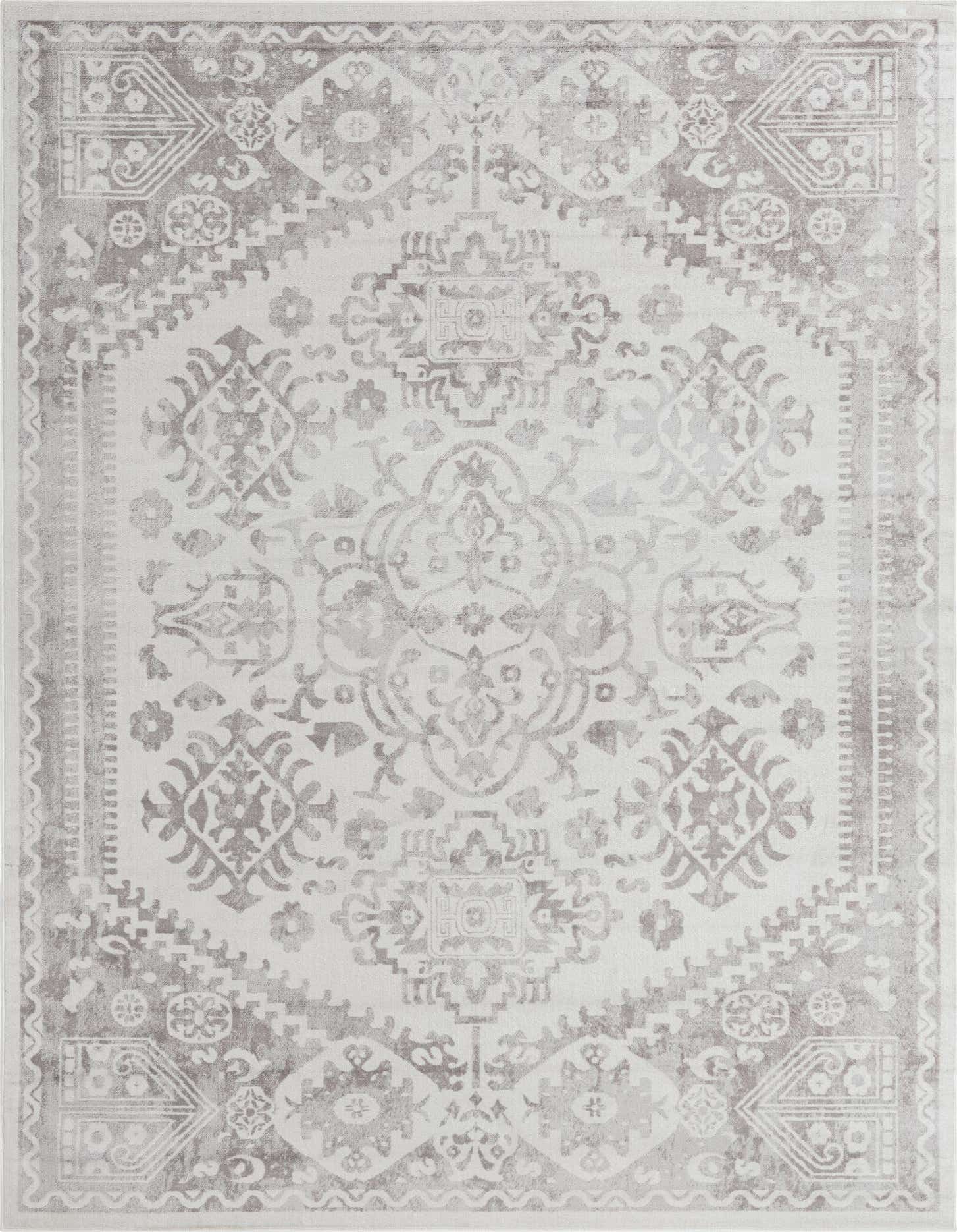 A 9x12 rectangular ivory and cream area rug with a distressed Bohemian medallion and traditional pattern, suitable for a living room.