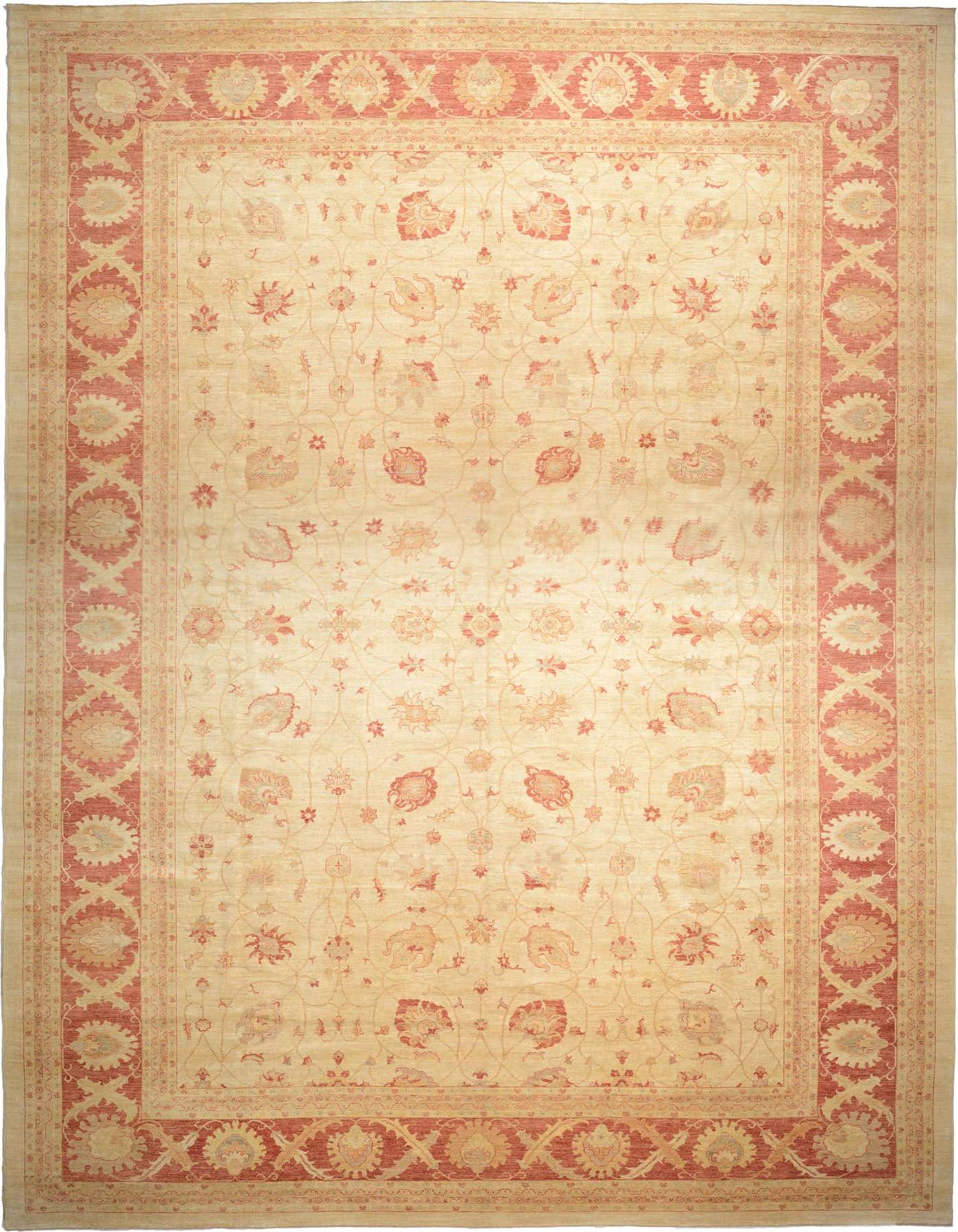 A large 13x18 rectangular ivory Peshawar Ziegler rug with a traditional botanical and floral pattern in muted reds and creams, featuring a tribal border.